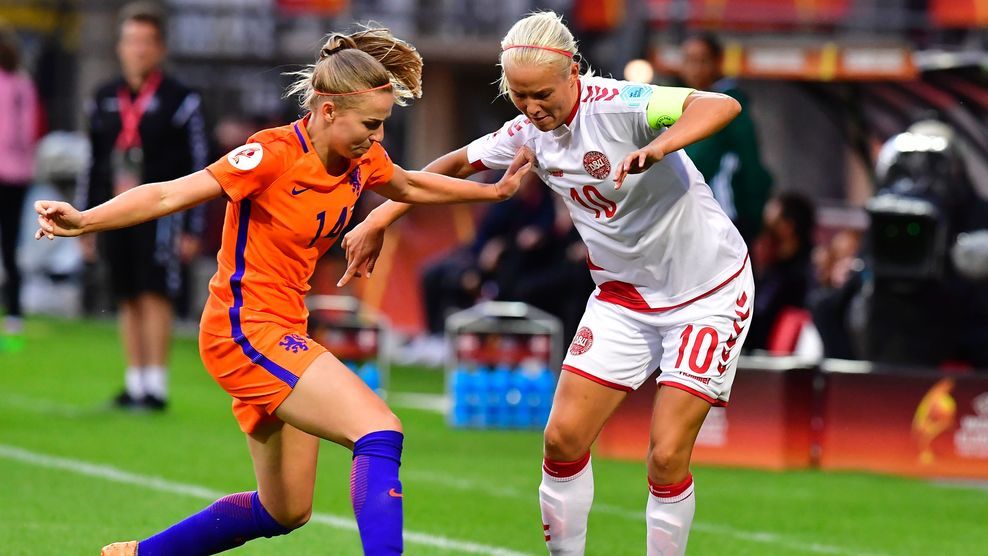 Netherlands' midfielder Jackie Groenen (L) vies with Denmark's forward Pernille Harder during the UEFA Women's Euro 2017 tournament football match between Netherlands and Denmark at Stadium Sparta Rotterdam in Rotterdam on July 20, 2017.  / AFP PHOTO / TOBIAS SCHWARZ        (Photo credit should read TOBIAS SCHWARZ/AFP/Getty Images)