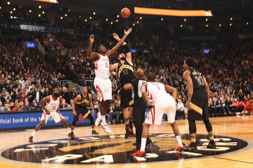 TORONTO, CANADA - MARCH 9: Jonas Valanciunas #17 of the Toronto Raptors and Clint Capela #15 of the Houston Rockets tip off at the start of the game on March 9, 2018 at the Air Canada Centre in Toronto, Ontario, Canada.  NOTE TO USER: User expressly acknowledges and agrees that, by downloading and or using this Photograph, user is consenting to the terms and conditions of the Getty Images License Agreement.  Mandatory Copyright Notice: Copyright 2018 NBAE (Photo by Ron Turenne/NBAE via Getty Images)