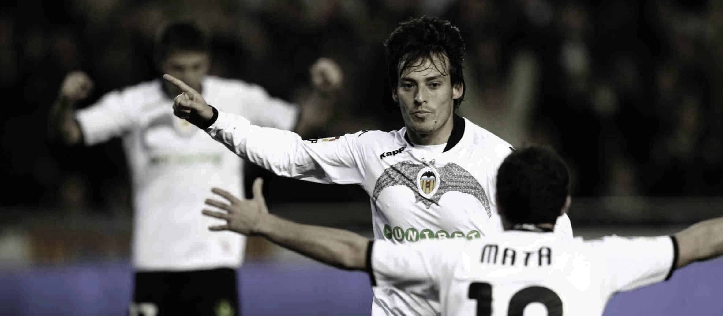 Valencia's midfielder David Silva (C) celebrates with teammate Valencia's midfielder Juan Mata after scoring against Villarreal their their Spanish league football match at Mestalla Stadium in Valencia, on January 17,  2010.AFP PHOTO/JOSE JORDAN (Photo credit should read JOSE JORDAN/AFP/Getty Images)