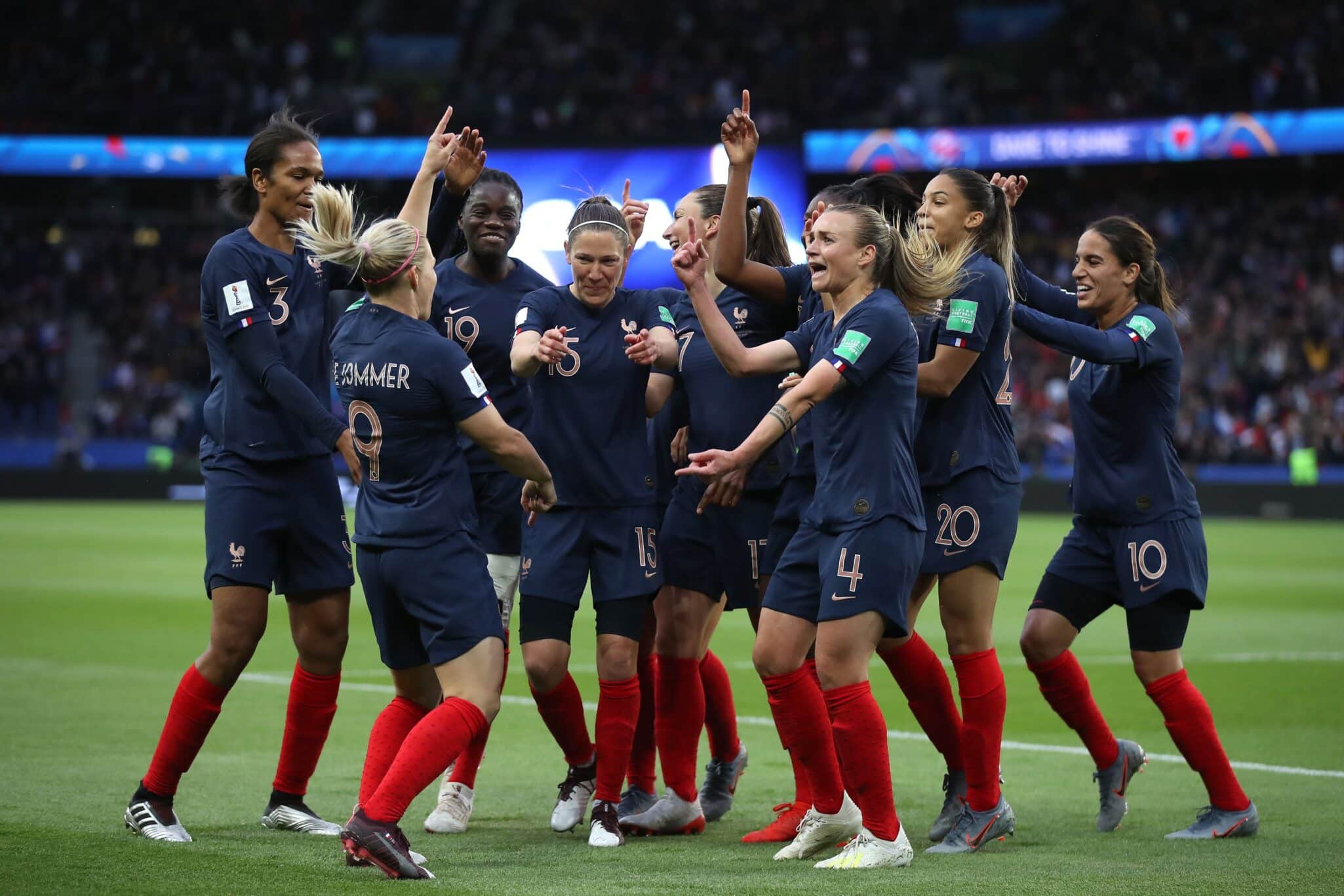 PARIS, FRANCE - JUNE 07: Eugenie Le Sommer of France celebrates with teammates after scoring her team's first goal during the 2019 FIFA Women's World Cup France group A match between France and Korea Republic at Parc des Princes on June 07, 2019 in Paris, France. (Photo by Alex Grimm/Bongarts/Getty Images)