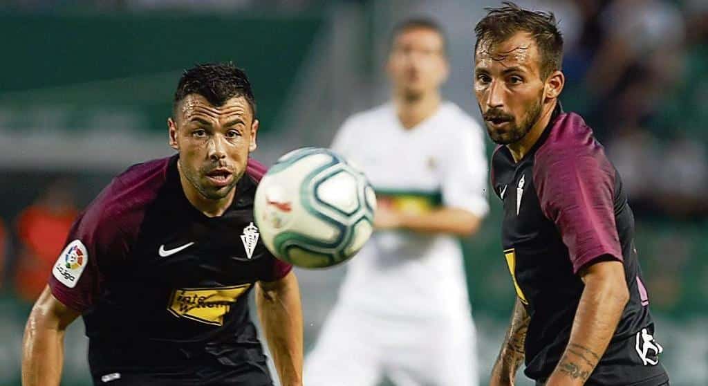 Aitor García y Javi Fuego en el partido del Martínez Valero