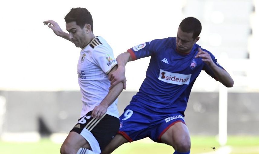 Andy Rodríguez con Obieta en un partido entre Burgos y Amorebieta