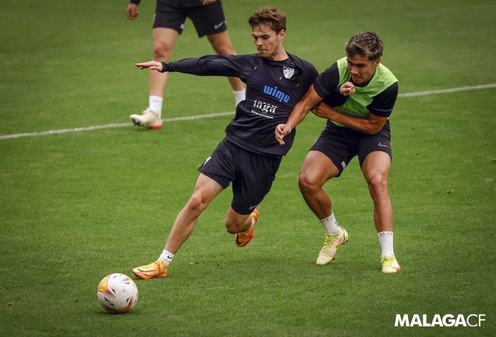 Aleix Febas con Kevin en un entrenamiento del Málaga