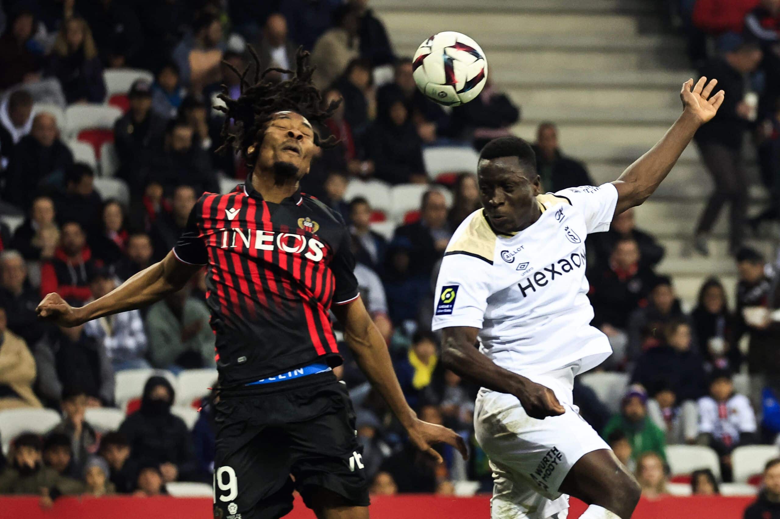 Nice's French midfielder Khephren Thuram (L) fights for the ball with Reims' Senegalese midfielder Dion Lopy (R) during the French L1 football match between OGC Nice and Stade de Reims at the Allianz Riviera Stadium in Nice, south-eastern France, on February 18, 2023. (Photo by Valery HACHE / AFP) (Photo by VALERY HACHE/AFP via Getty Images)