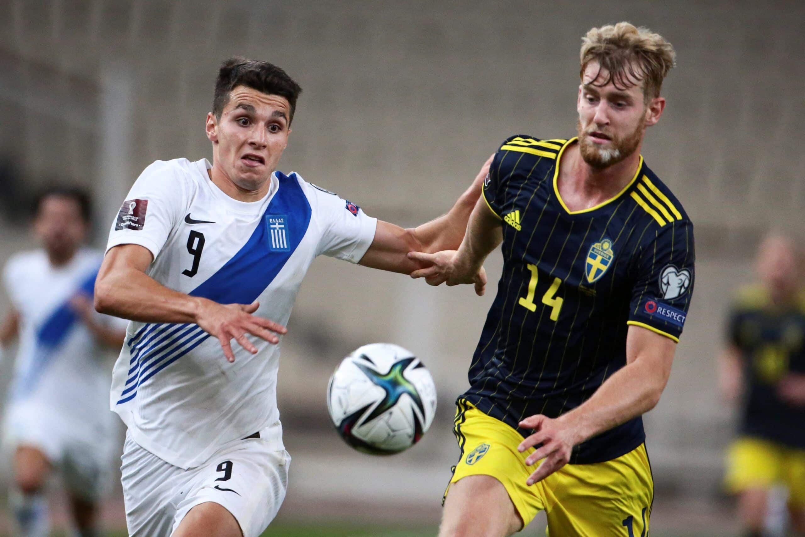 Greece's Anastasios Douvikas (L) fights for the ball with Sweden's Filip Helander during the World Cup 2022 qualifing football match Greece vs Sweden at the Olympic stadium in Athens, on September 8, 2021. (Photo by STR / EUROKINISSI / AFP) (Photo by STR/EUROKINISSI/AFP via Getty Images)