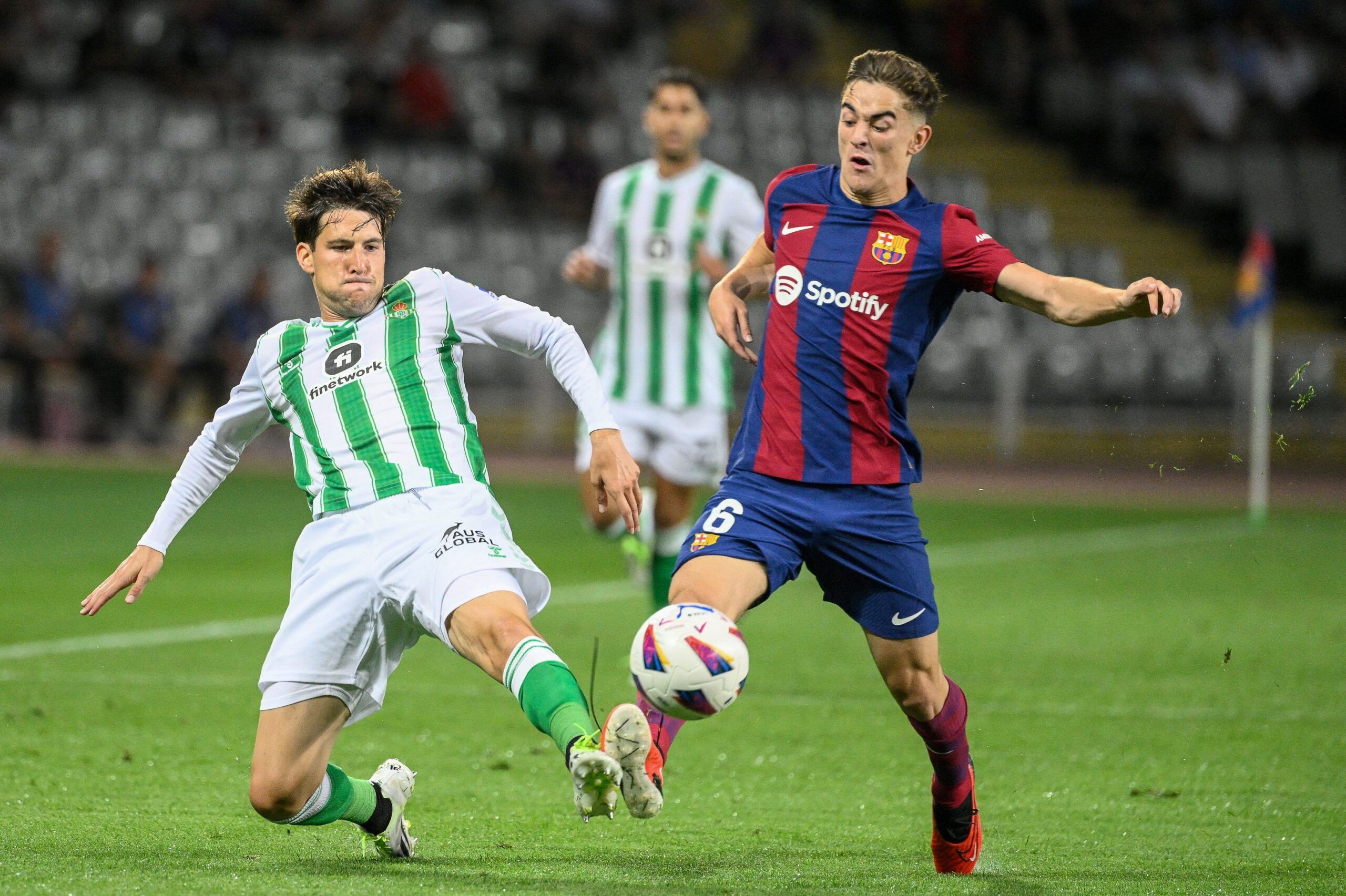 Real Betis' Spanish defender #03 Juan Miranda fights for the ball with Barcelona's Spanish midfielder #06 Gavi during the Spanish Liga football match between FC Barcelona and Real Betis at the Estadi Olimpic Lluis Companys in Barcelona on September 16, 2023. (Photo by Josep LAGO / AFP) (Photo by JOSEP LAGO/AFP via Getty Images)