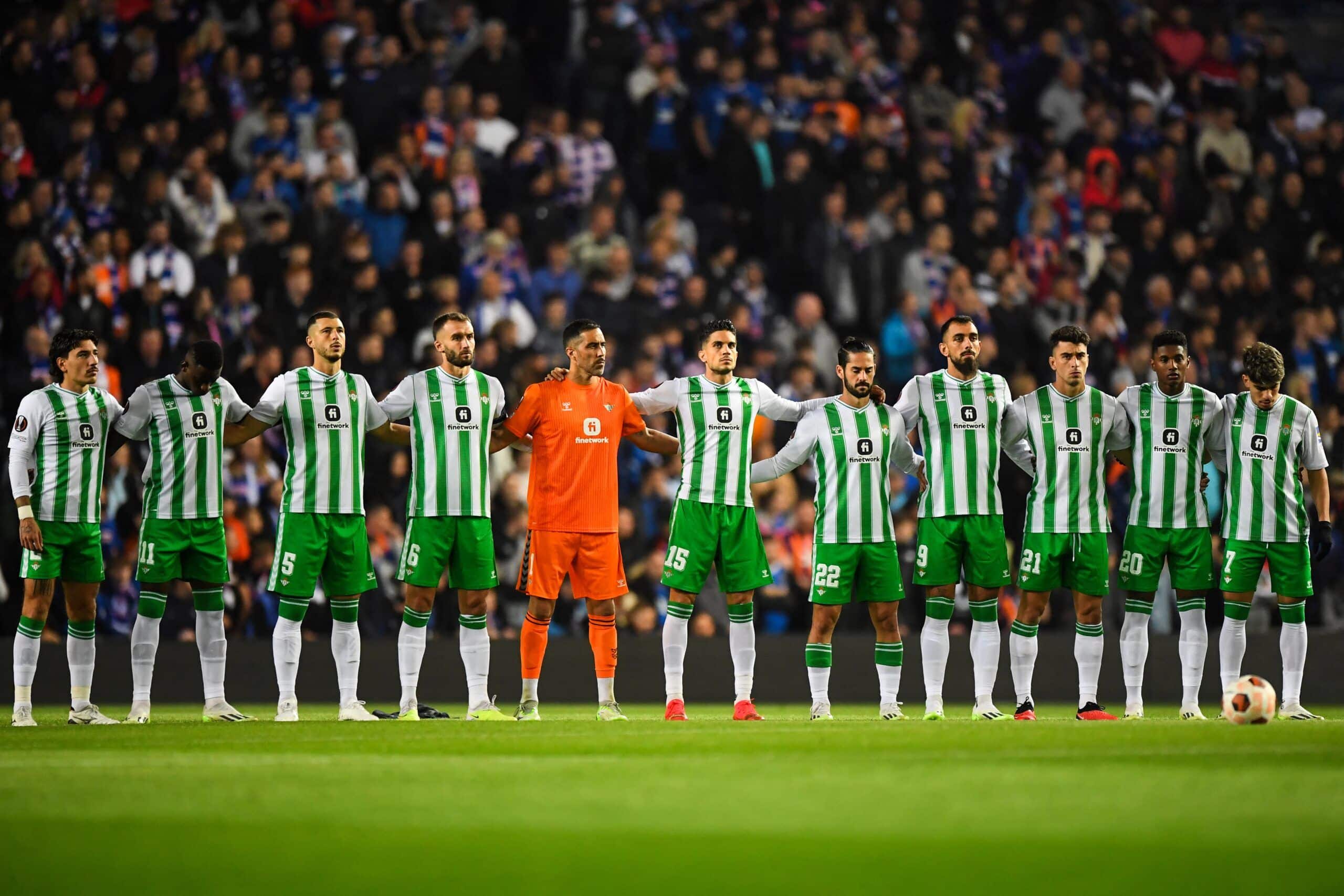 Real Betis players stands guard prior to the UEFA Europa League group C football match between Glasgow Rangers and  Real Betis at Ibrox Stadium in Glasgow, Scotland, on September 21, 2023. (Photo by ANDY BUCHANAN / AFP) (Photo by ANDY BUCHANAN/AFP via Getty Images)