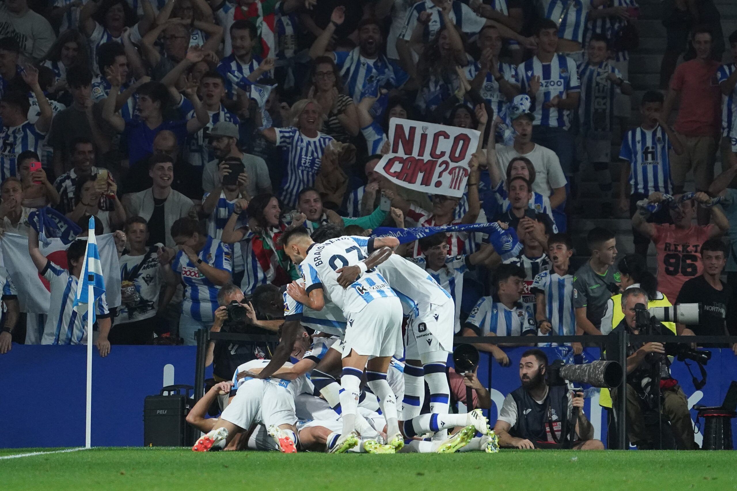 Real Sociedad's French defender #24 Robin Le Normand celebrates with teammates after scoring his team's first goal during the Spanish Liga football match between Real Sociedad and Athletic Club Bilbao at the Anoeta stadium in San Sebastian on September 30, 2023. (Photo by CESAR MANSO / AFP) (Photo by CESAR MANSO/AFP via Getty Images)