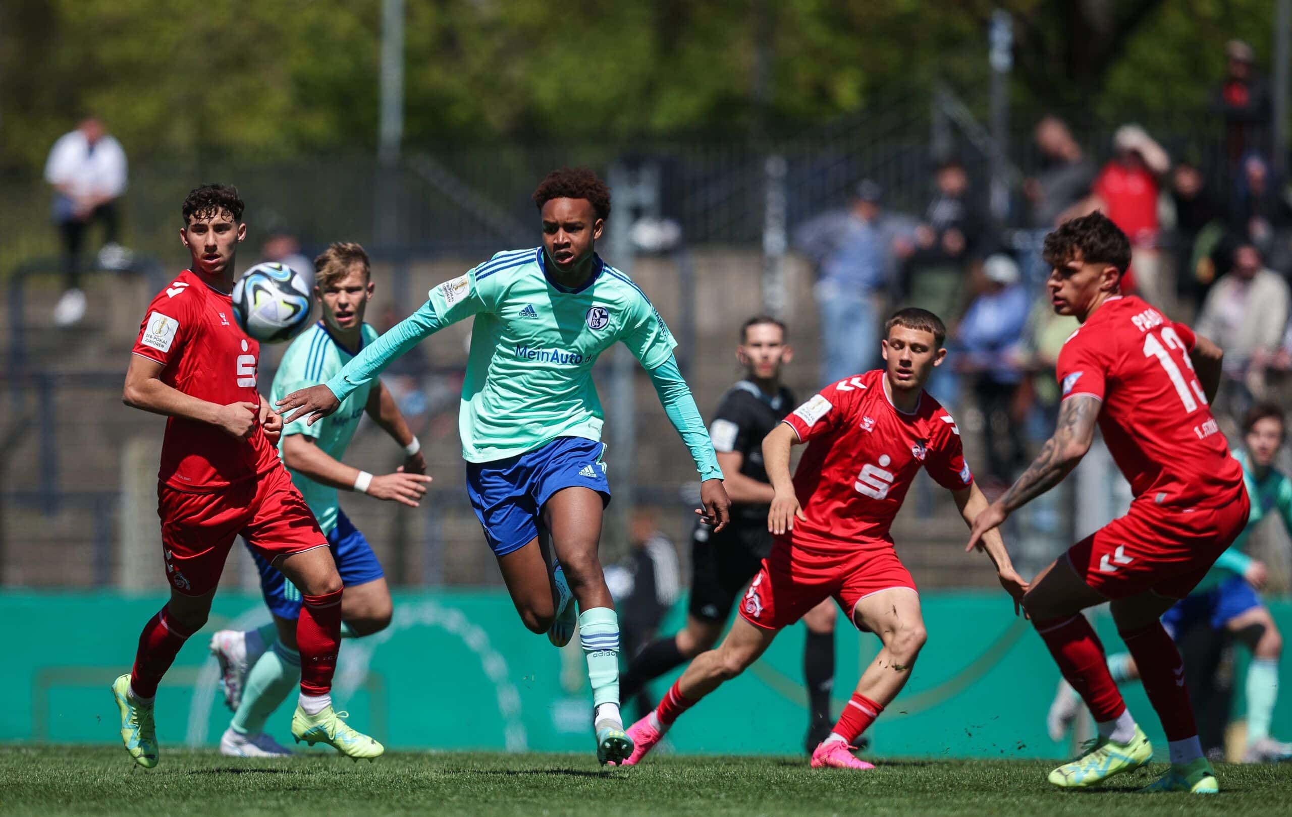 POTSDAM, GERMANY - APRIL 30: Assan Ouédraogo (2nd L) of Schalke vies for the ball with Luan Simnica (L) and Julian Pauli (R) of Koeln during the DFB Junior Cup Final match between FC Schalke 04 U19 and 1. FC Koeln U19 at Karl-Liebknecht-Stadion on April 30, 2023 in Potsdam, Germany. (Photo by Ronny Hartmann/Getty Images)