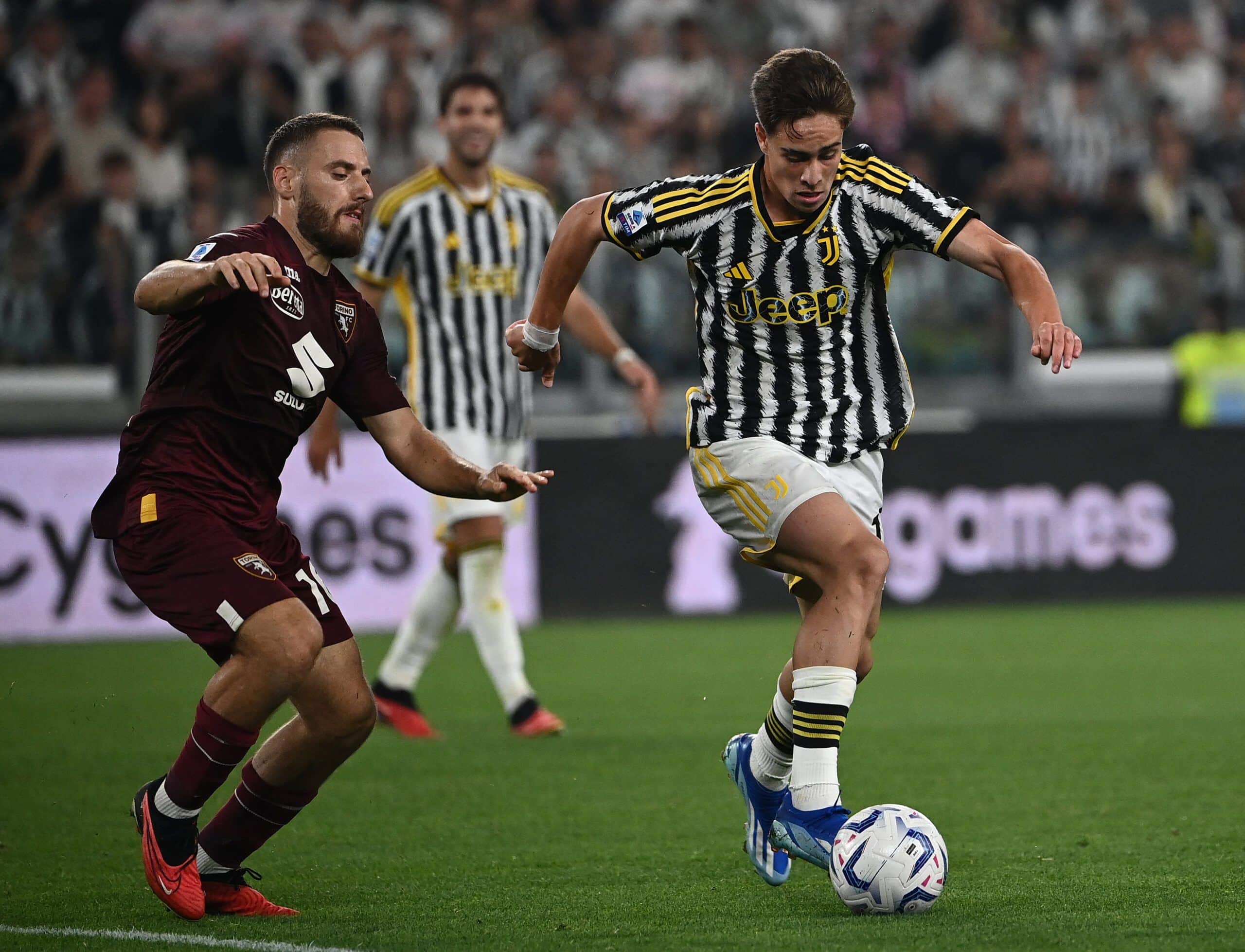 Juventus' Dutch defender #13 Dean Huijsen (R) fights for the ball with Torino's Croatian midfielder #16 Nikola Vlasic (L) during the Italian Serie A football match Juventus vs Torino, at Allianz stadium in Turin, on October 7, 2023. (Photo by Isabella BONOTTO / AFP) (Photo by ISABELLA BONOTTO/AFP via Getty Images)