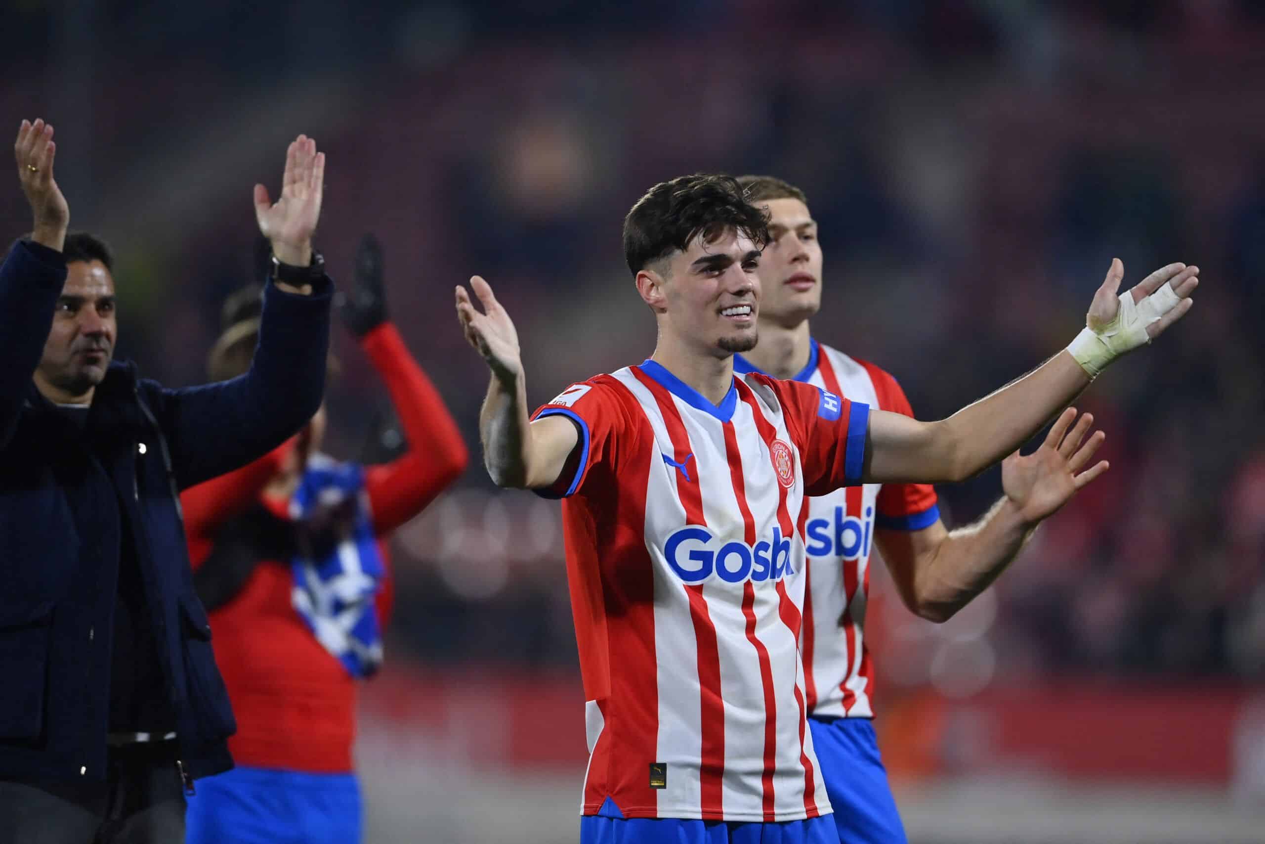 Girona's Spanish defender #03 Miguel Gutierrez celebrates victory at the end of the Spanish league football match between Girona FC and Deportivo Alaves at the Montilivi stadium in Girona on December 18, 2023. Girona won 3-0. (Photo by Pau BARRENA / AFP) (Photo by PAU BARRENA/AFP via Getty Images)