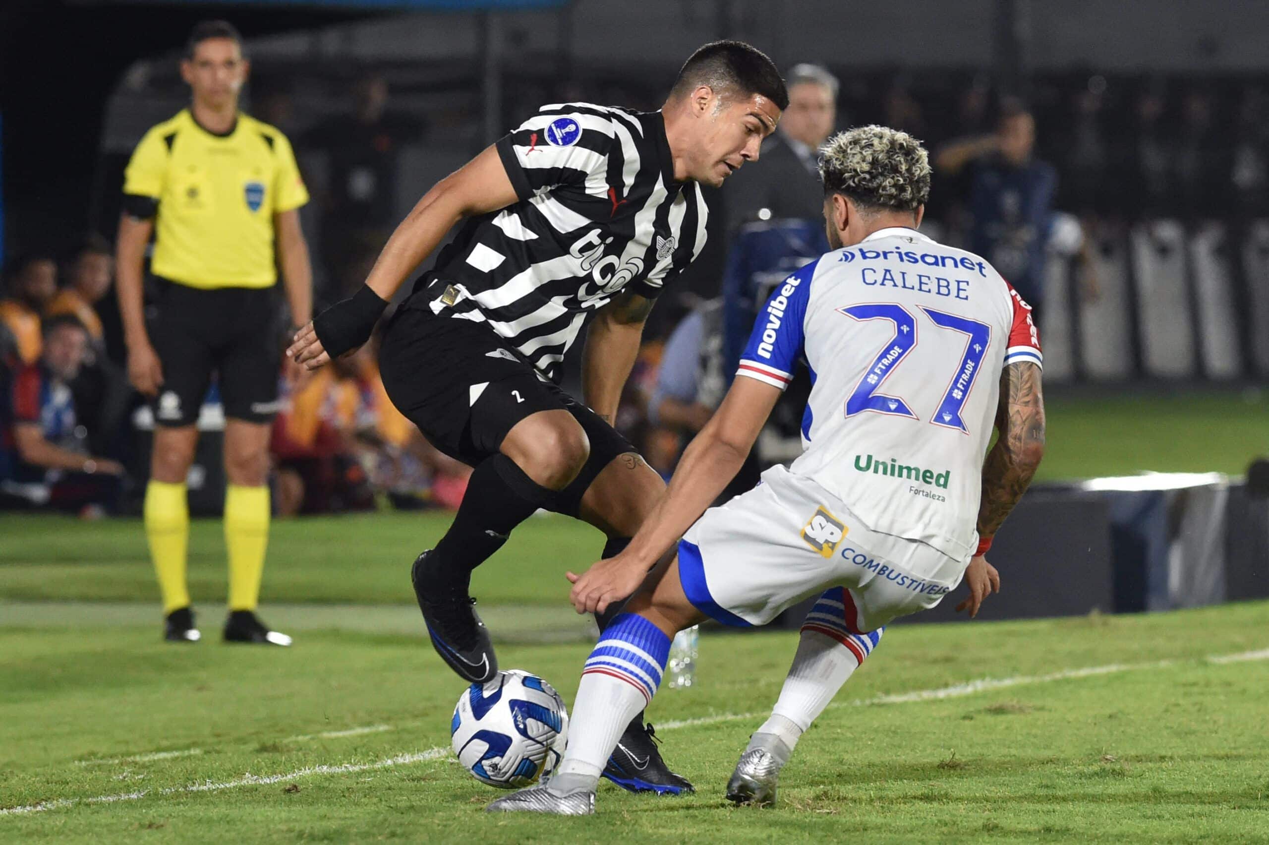 Libertad's defender Ivan Ramirez (L) and Fortaleza's midfielder Calebe fight for the ball during the Copa Sudamericana round of 16 first leg football match between Paraguay's Libertad and Brazil's Fortaleza at the Defensores del Chaco stadium in Asuncion, on August 1, 2023. (Photo by Norberto DUARTE / AFP) (Photo by NORBERTO DUARTE/AFP via Getty Images)