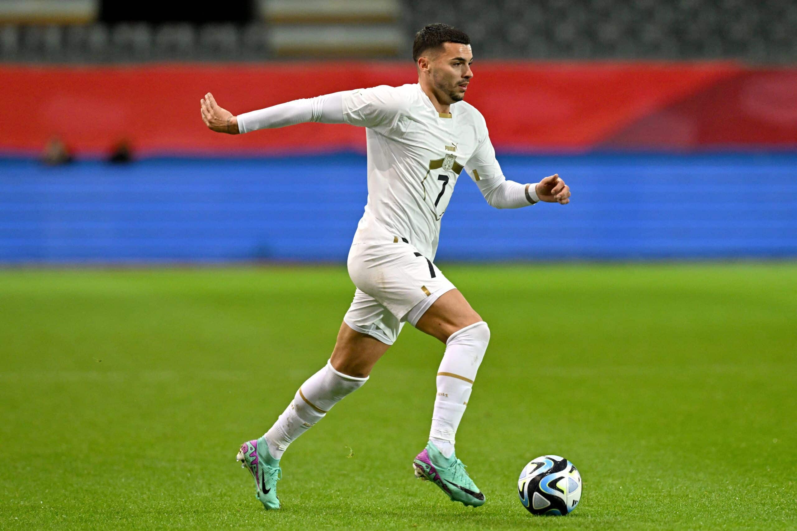 Serbia's forward #07 Nemanja Radonjic runs with the ball during the international friendly football match between Belgium and Serbia at the King Power at den Dreef Stadium in Heverlee on November 15, 2023. (Photo by JOHN THYS / AFP) (Photo by JOHN THYS/AFP via Getty Images)