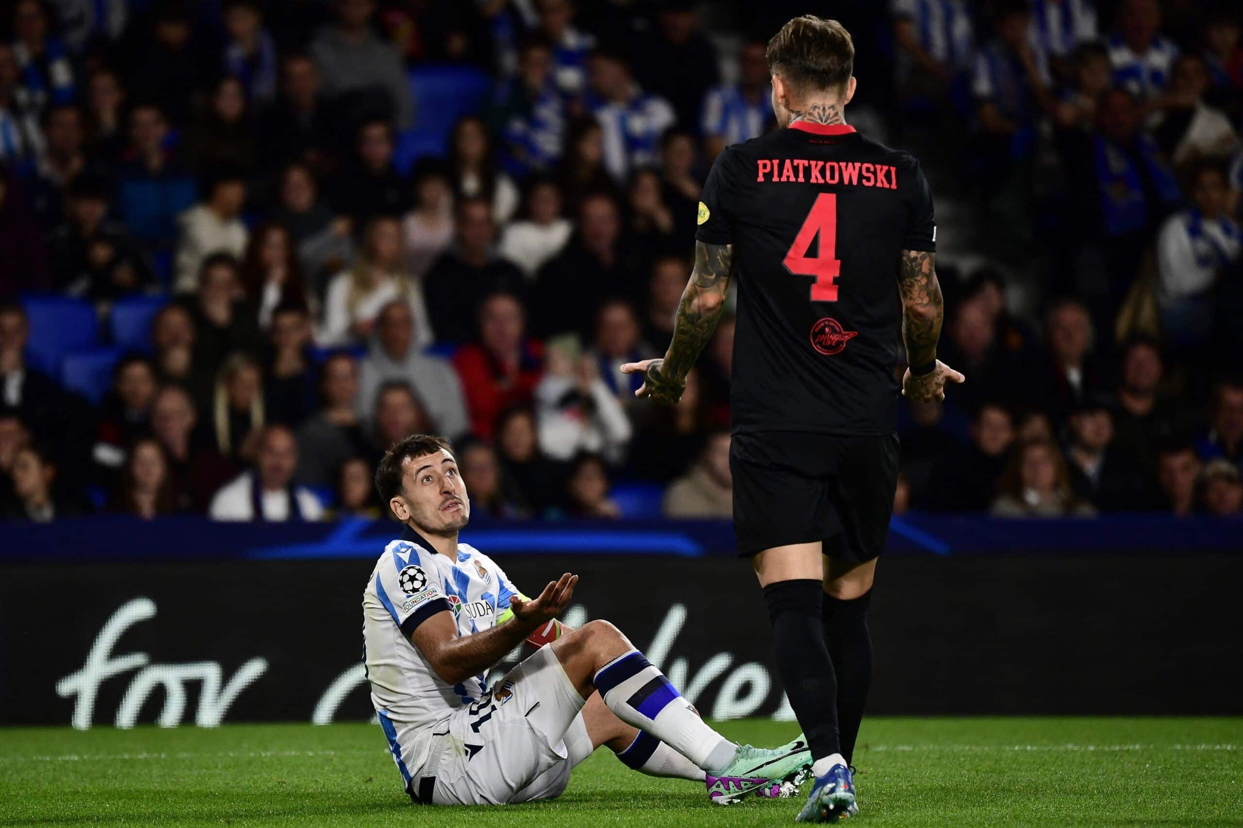 Real Sociedad's Spanish midfielder #10 Mikel Oyarzabal and Salzburg's Polish defender #04 Kamil Piatkowski react during the UEFA Champions League first round group D football match between Real Sociedad and FC Salzburg at the Anoeta stadium in San Sebastian on November 29, 2023. (Photo by ANDER GILLENEA / AFP) (Photo by ANDER GILLENEA/AFP via Getty Images)