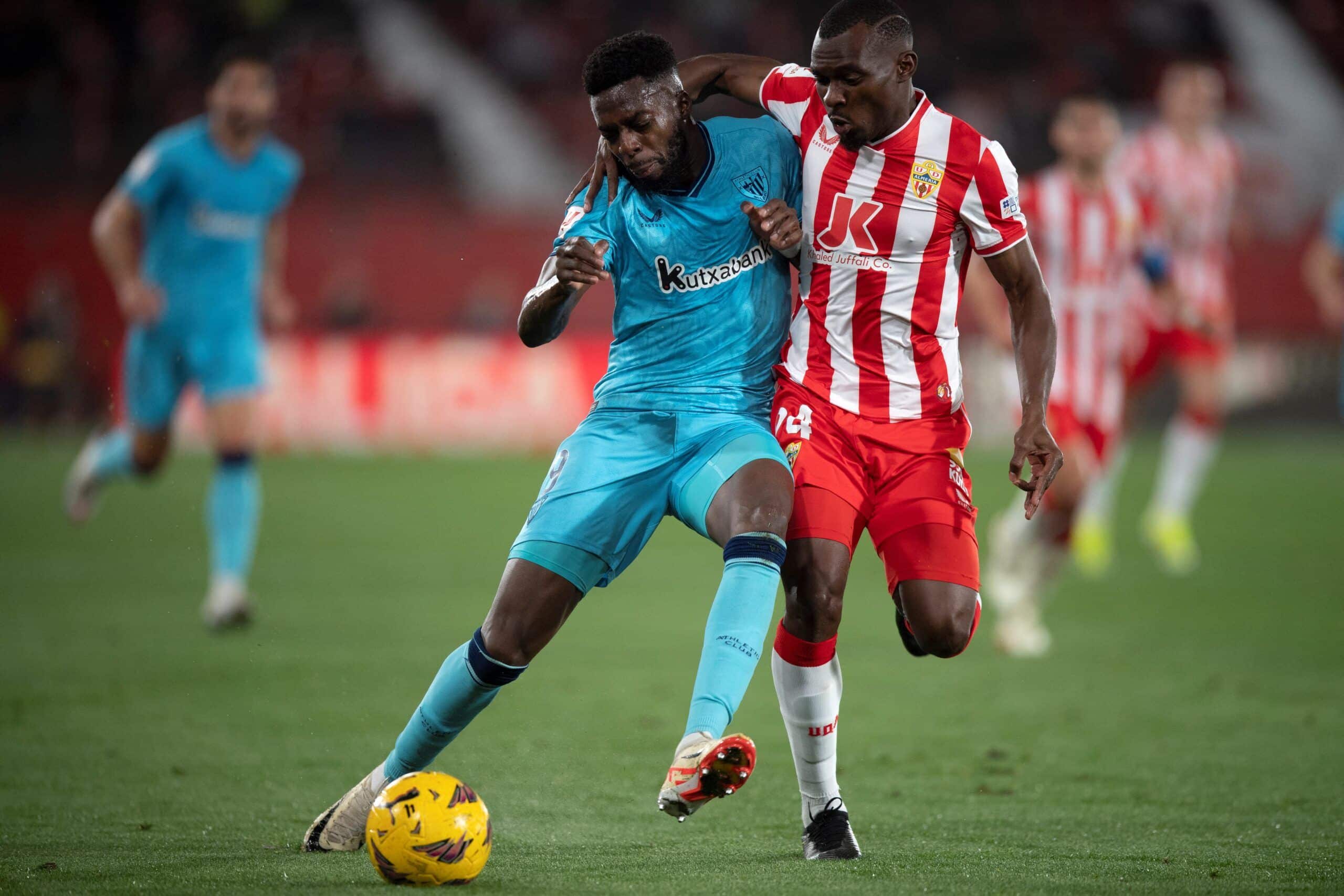 Athletic Bilbao's Spanish forward #09 Inaki Williams fights for the ball with Almeria's Mozambican defender #24 Bruno Alberto Langa during the Spanish league football match between UD Almeria and Athletic Club Bilbao at the Municipal Stadium of the Mediterranean Games in Almeria on February 12, 2024. (Photo by JORGE GUERRERO / AFP) (Photo by JORGE GUERRERO/AFP via Getty Images)