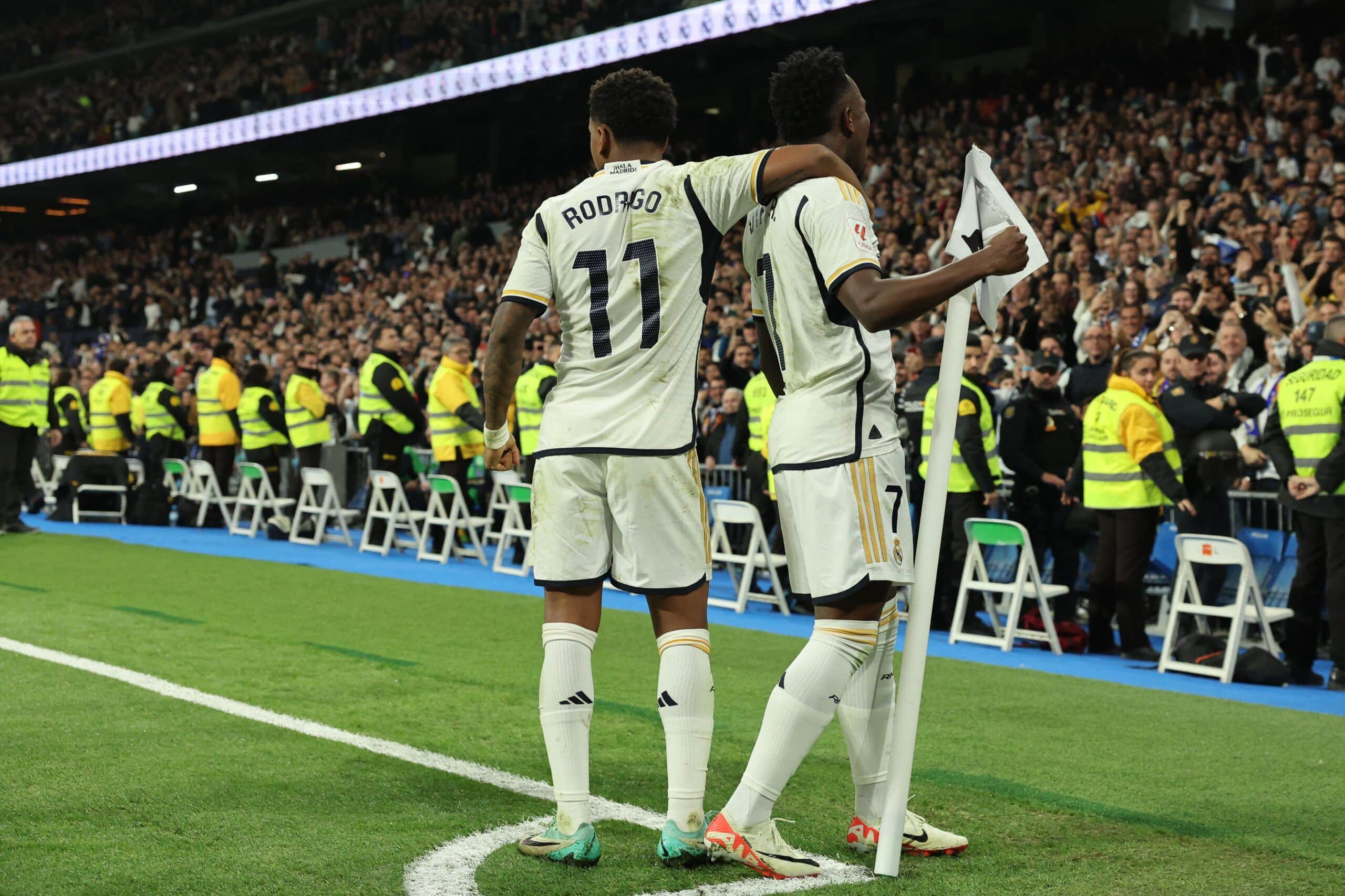 Real Madrid's Brazilian forward #07 Vinicius Junior celebrates scoring his team's third goal with Real Madrid's Brazilian forward #11 Rodrygo during the Spanish league football match between Real Madrid CF and Valencia CF at the Santiago Bernabeu stadium in Madrid on November 11, 2023. (Photo by Thomas COEX / AFP) (Photo by THOMAS COEX/AFP via Getty Images)