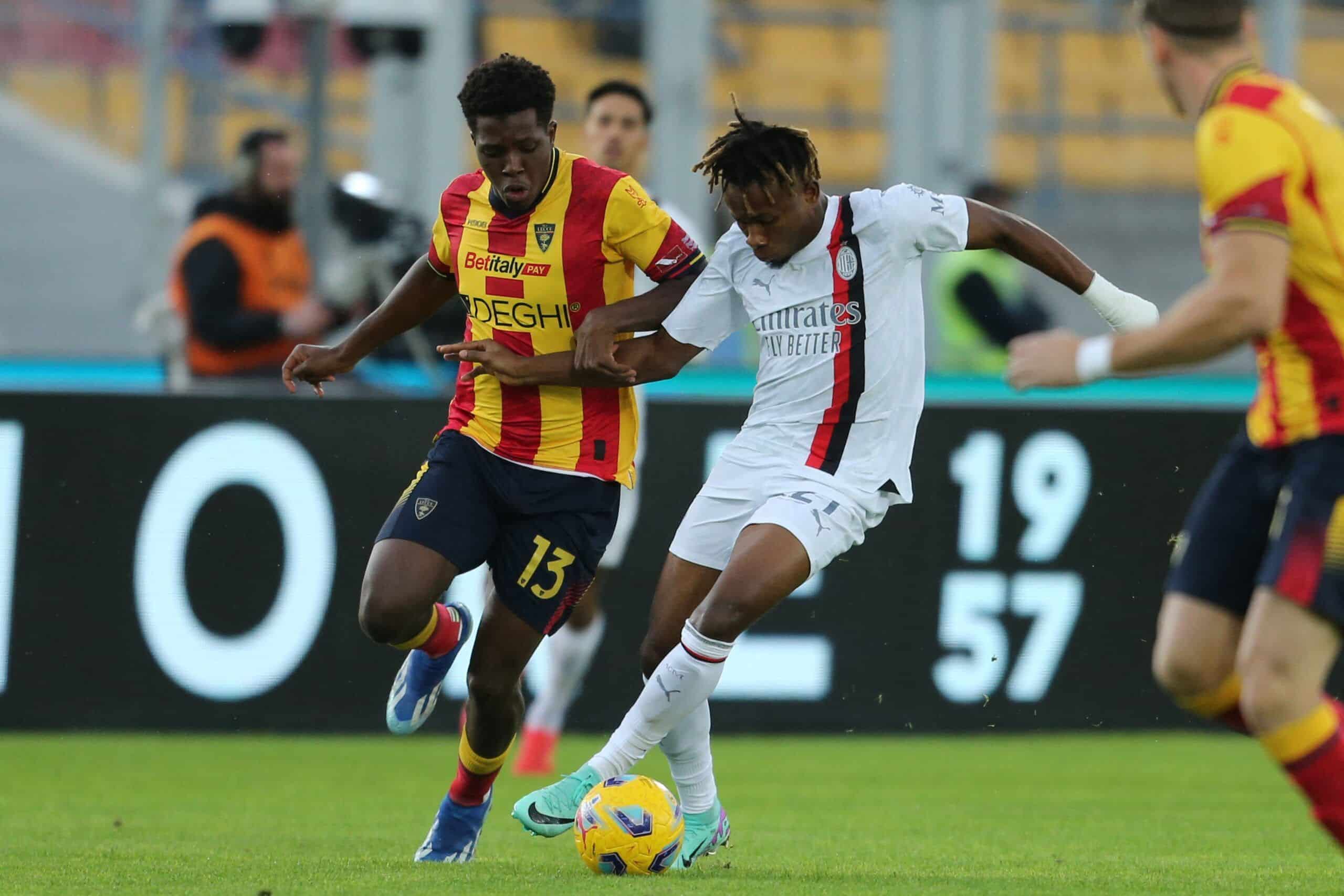 AC Milan's Nigerian midfielder #21 Samuel Chukwueze fights for the ball with Lecce's Danish defender #13 Patrick Dorgu during the Italian Serie A football match between Lecce and AC Milan at the Ettore Giardiniero stadium in Lecce, on November 11, 2023. (Photo by Carlo Hermann / AFP) (Photo by CARLO HERMANN/AFP via Getty Images)