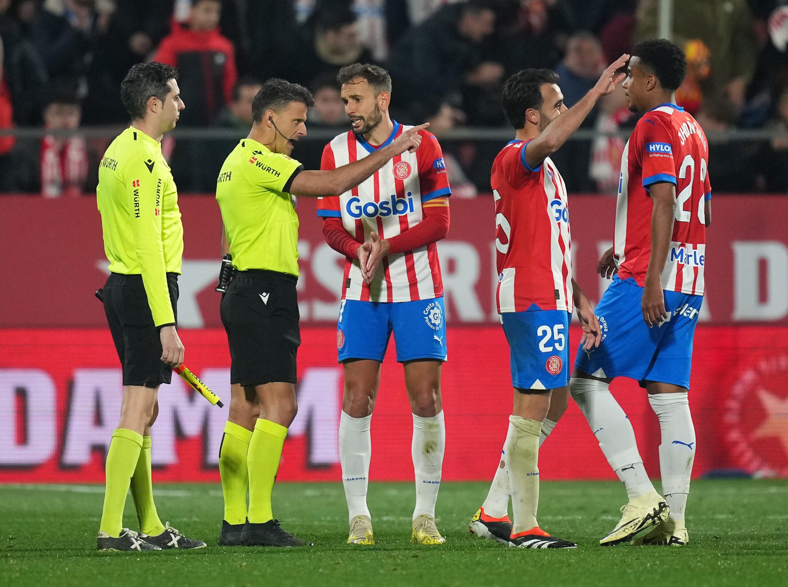 GIRONA, SPAIN - FEBRUARY 03: Cristhian Stuani of Girona FC speaks with referee Jesus Gil Manzano after the LaLiga EA Sports match between Girona FC and Real Sociedad at Montilivi Stadium on February 03, 2024 in Girona, Spain. (Photo by Alex Caparros/Getty Images)