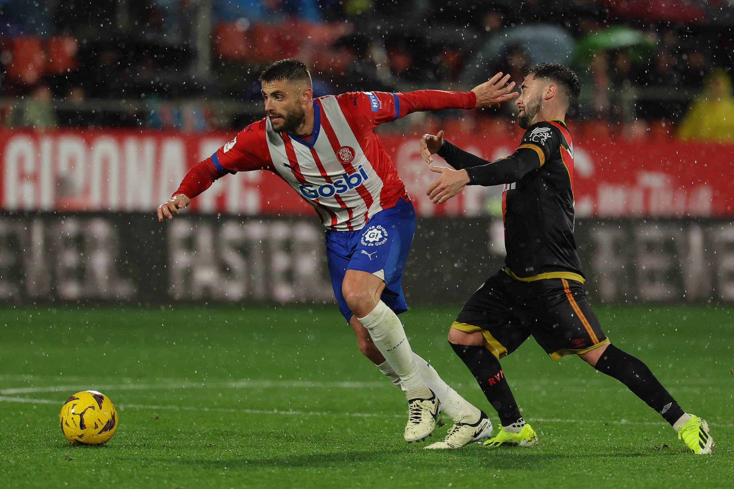 Girona's Spanish midfielder #05 David Lopez (L) fights for the ball with Rayo Vallecano's Spanish midfielder #17 Unai Lopez during the Spanish league football match between Girona FC and Rayo Vallecano de Madrid at the Montilivi stadium in Girona on February 26, 2024. (Photo by LLUIS GENE / AFP) (Photo by LLUIS GENE/AFP via Getty Images)