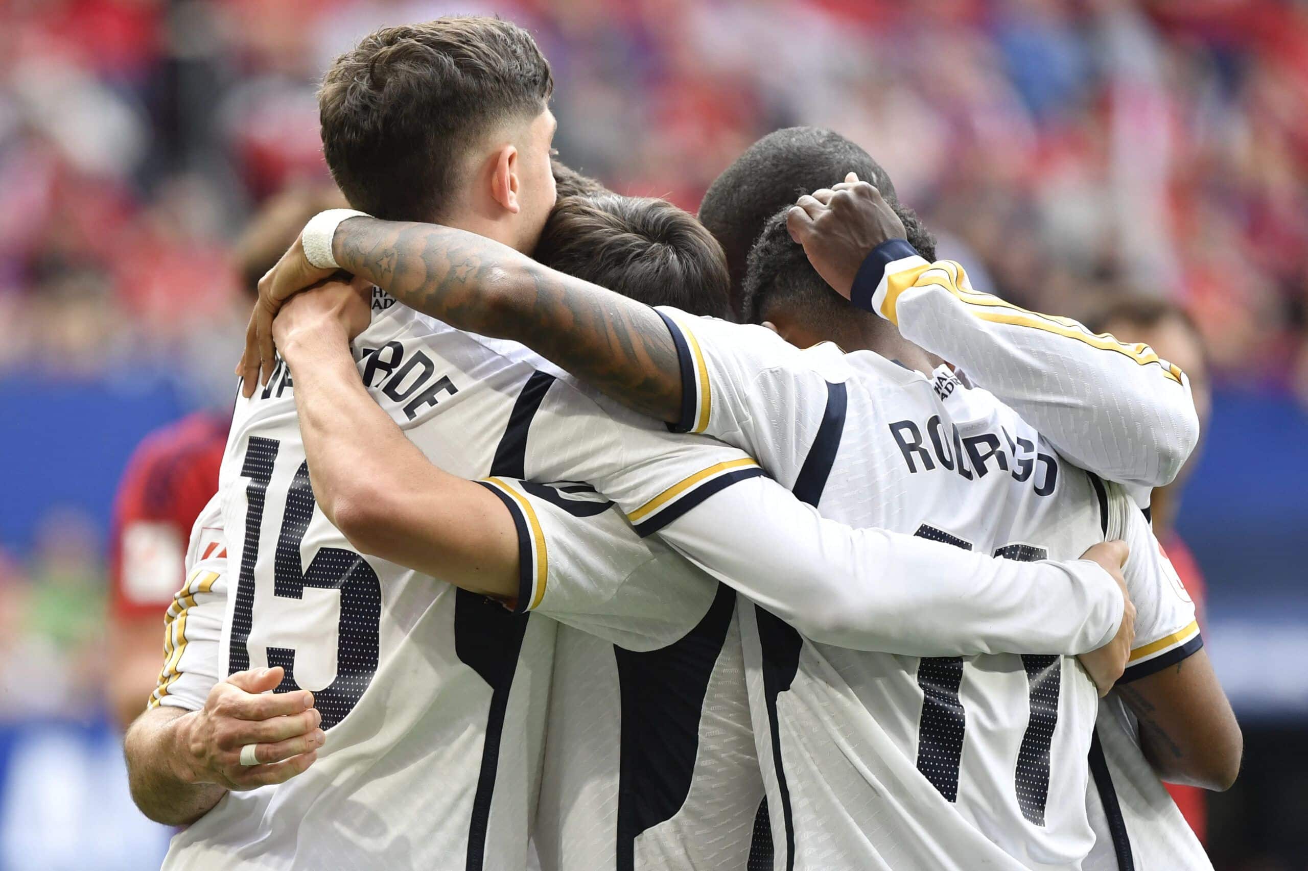 Real Madrid's players celebrate their second goal scored by Spanish defender #02 Dani Carvajal during the Spanish league football match between CA Osasuna and Real Madrid CF at El Sadar stadium in Pamplona on March 16, 2024. (Photo by Ander Gillenea / AFP) (Photo by ANDER GILLENEA/AFP via Getty Images)