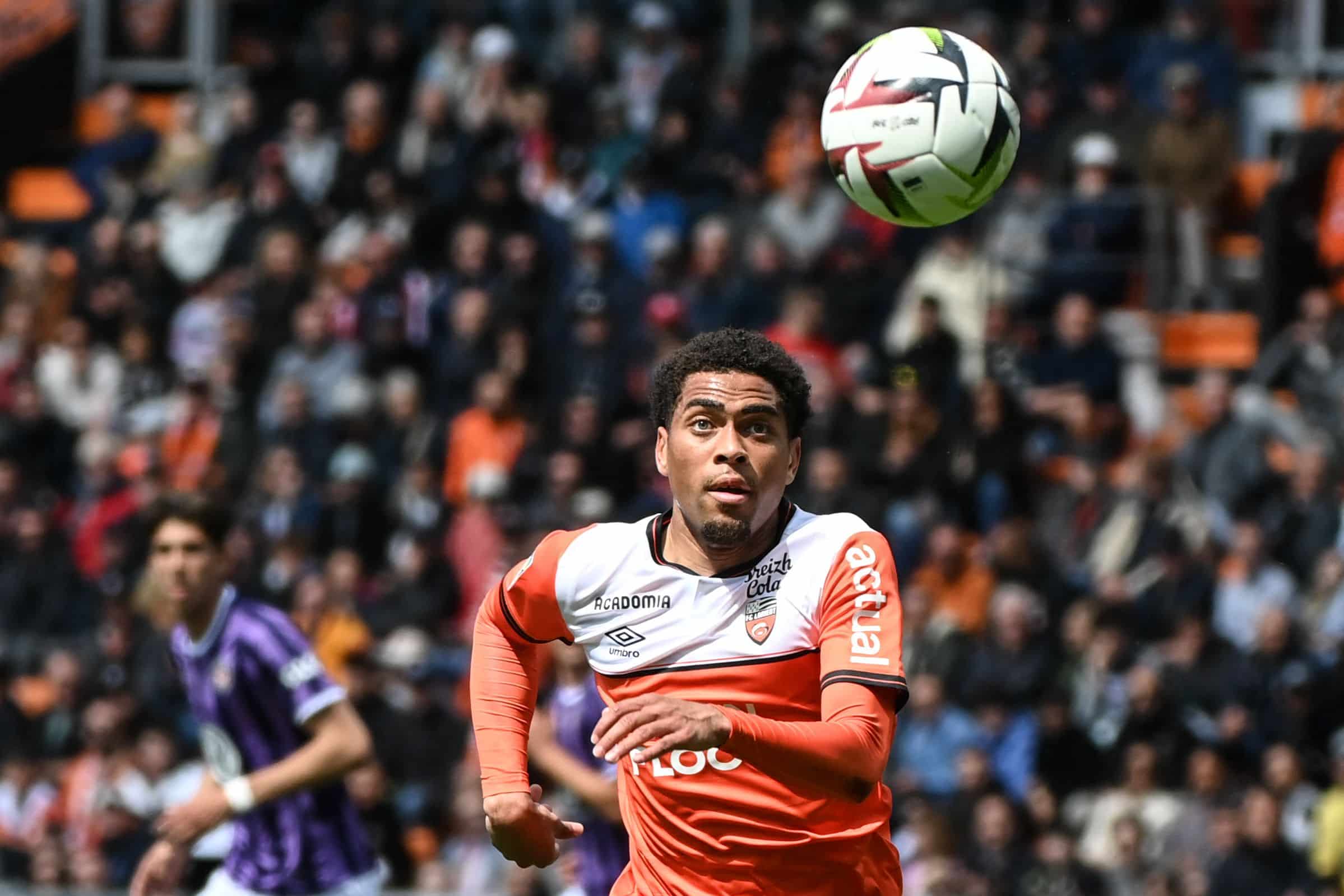 Lorient's French midfielder #21 Julien Ponceau eyes the ball during the French L1 football match between FC Lorient and Toulouse FC at Stade du Moustoir in Lorient, western France, on April 28, 2024. (Photo by Sebastien SALOM-GOMIS / AFP) (Photo by SEBASTIEN SALOM-GOMIS/AFP via Getty Images)
