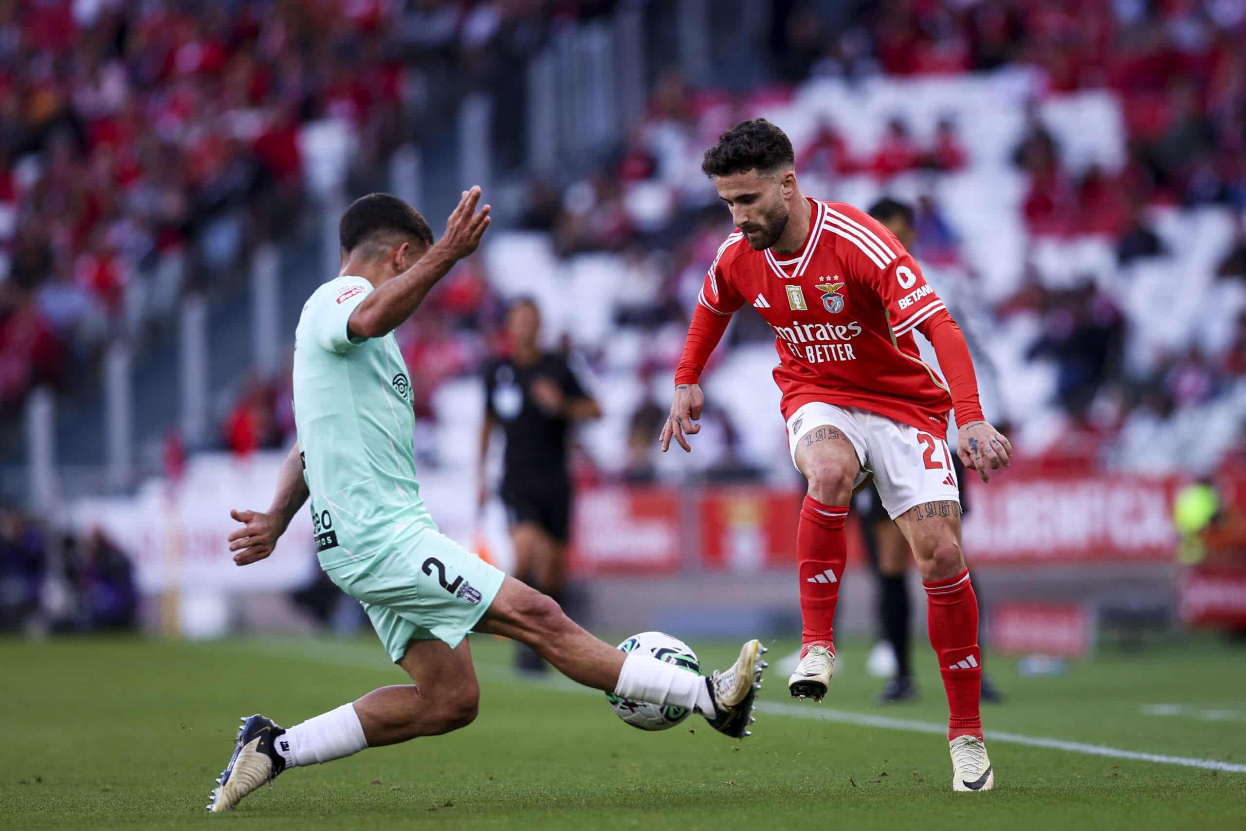 Benfica's Portuguese forward Rafa Silva #27 fights for the ball with Braga's Spanish defender Victor Gomez during the Portuguese League football match between SL Benfica and SC Braga at the Luz stadium in Lisbon on April 27, 2024. (Photo by FILIPE AMORIM / AFP) (Photo by FILIPE AMORIM/AFP via Getty Images)