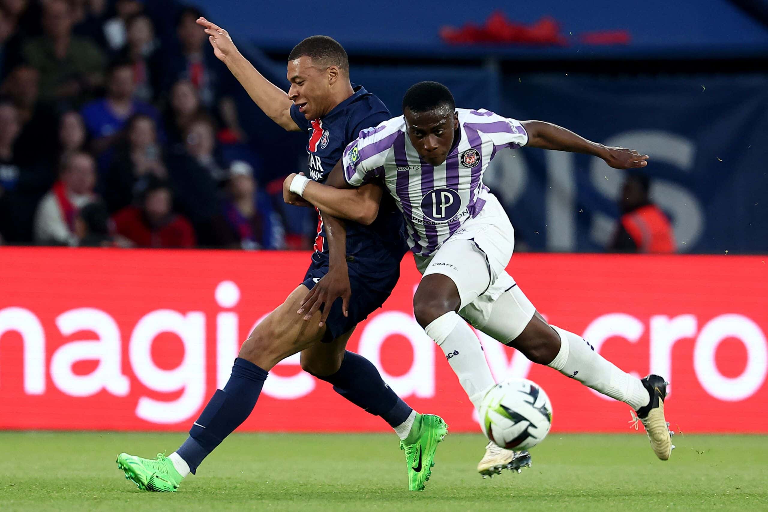 Paris Saint-Germain's French forward #07 Kylian Mbappe (L) vies with Toulouse's French Malian defender #23 Moussa Diarra (R) during the French L1 football match between Paris Saint-Germain (PSG) and Toulouse (TFC) on May 12, 2024 at the Parc des Princes stadium in Paris. (Photo by FRANCK FIFE / AFP) (Photo by FRANCK FIFE/AFP via Getty Images)