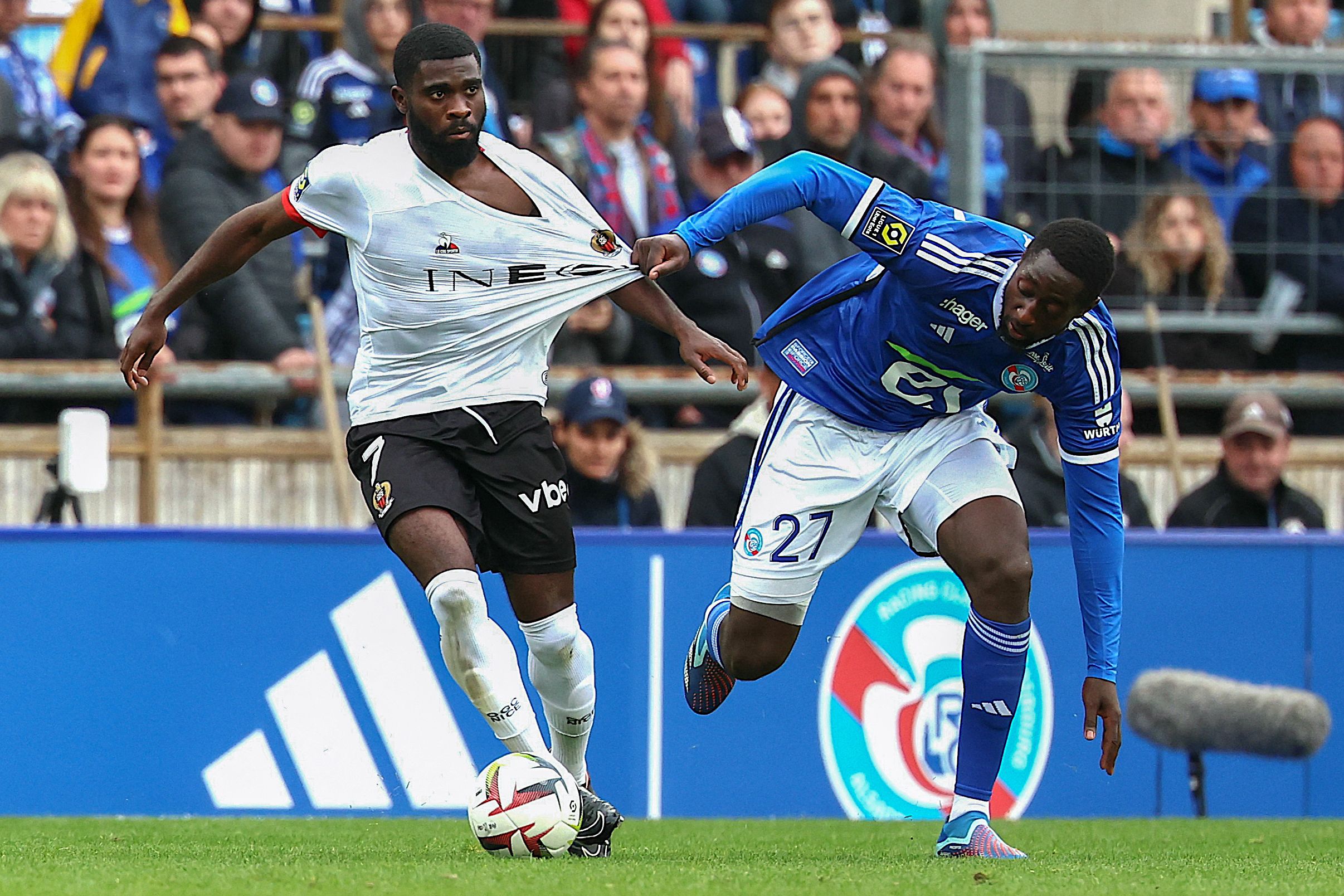 Strasbourg's French midfielder #27 Ibrahima Sissoko (R) fights for the ball with Nice's Ivorian forward #07 Jeremie Boga during the French L1 football match between RC Strasbourg Alsace and OGC Nice at Stade de la Meinau in Strasbourg, eastern France, on April 28, 2024. (Photo by Frederick FLORIN / AFP) (Photo by FREDERICK FLORIN/AFP via Getty Images)