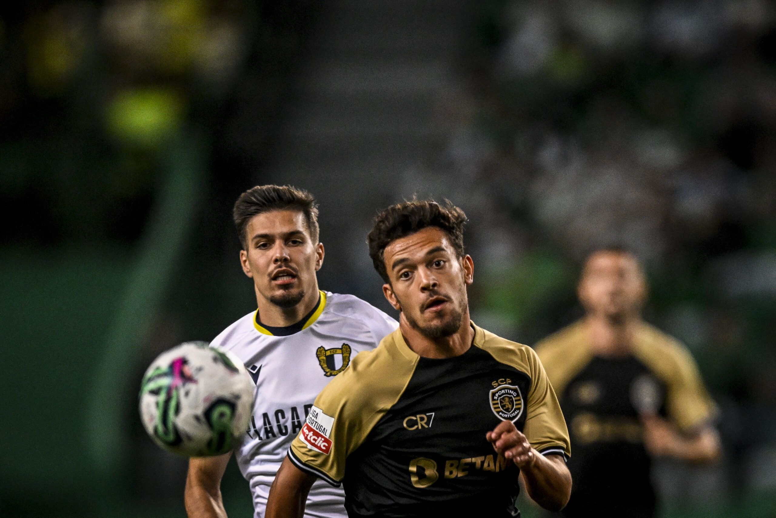 Sporting's Portuguese midfielder #8 Pedro Goncalves (R) vies with Famalicao's Portuguese defender #74 Francisco Moura during the Portuguese league football match between Sporting CP and FC Famalicao at Alvalade stadium in Lisbon on August 27, 2023. (Photo by Patricia DE MELO MOREIRA / AFP) (Photo by PATRICIA DE MELO MOREIRA/AFP via Getty Images)