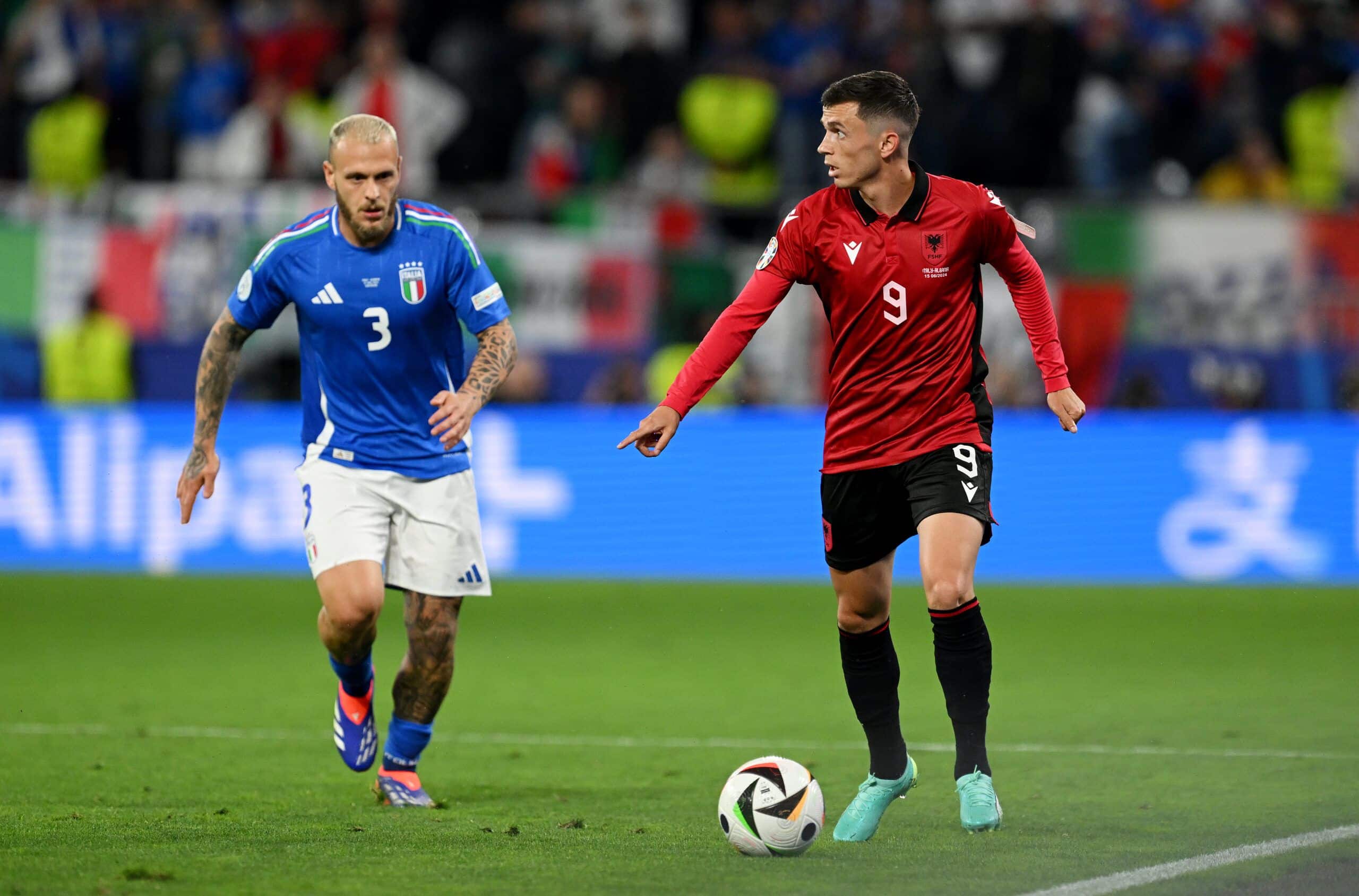 DORTMUND, GERMANY - JUNE 15: Jasir Asani of Albania runs with the ball whilst under pressure from Federico Dimarco of Italy during the UEFA EURO 2024 group stage match between Italy and Albania at Football Stadium Dortmund on June 15, 2024 in Dortmund, Germany. (Photo by Claudio Villa/Getty Images for FIGC)