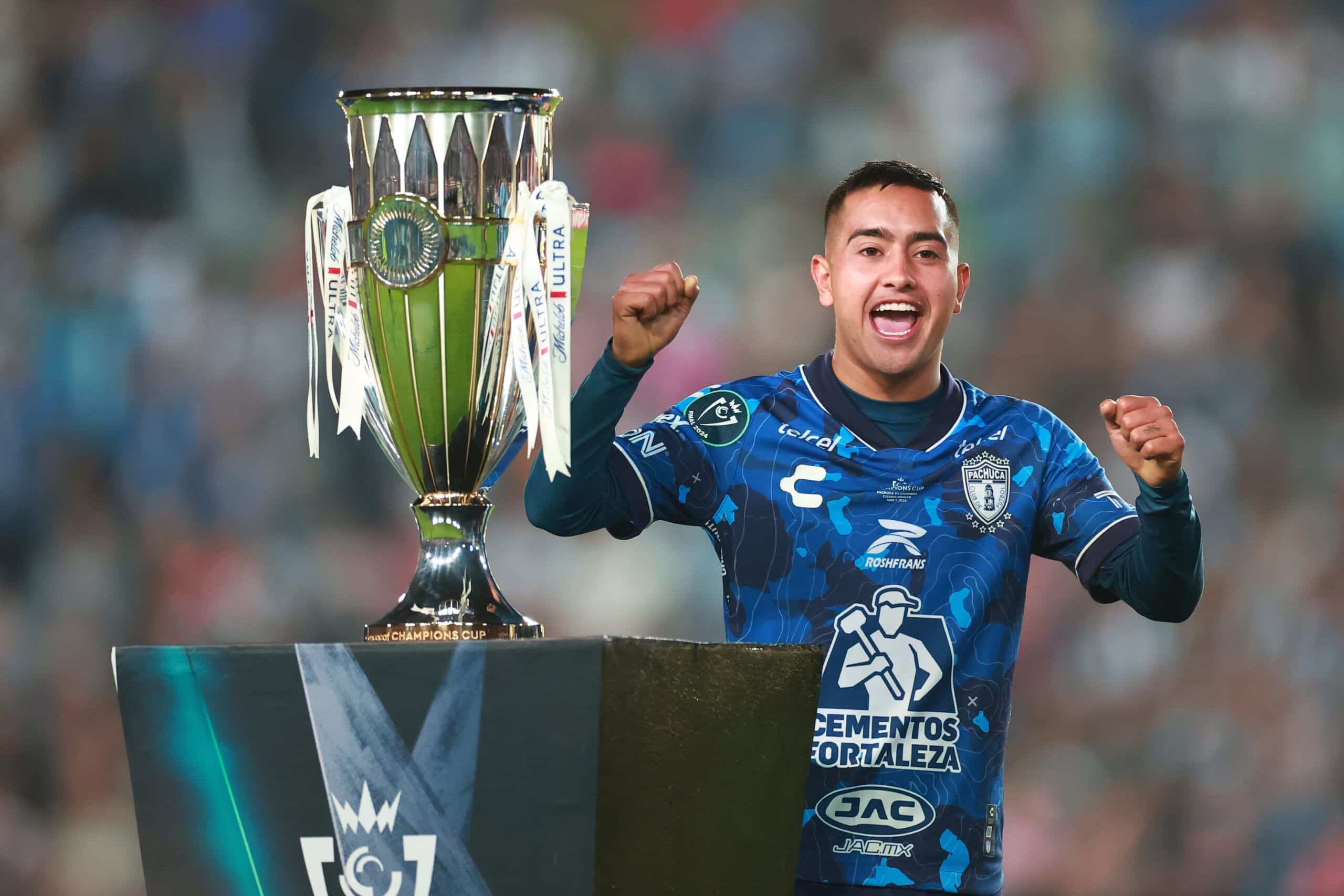 PACHUCA, MEXICO - JUNE 01: Erick Sanchez of Pachuca walks past the trophy in the medal ceremony after winning the 2024 Concacaf Champions Cup final match between Pachuca and Columbus Crew at Hidalgo Stadium on June 01, 2024 in Pachuca, Mexico. (Photo by Hector Vivas/Getty Images)