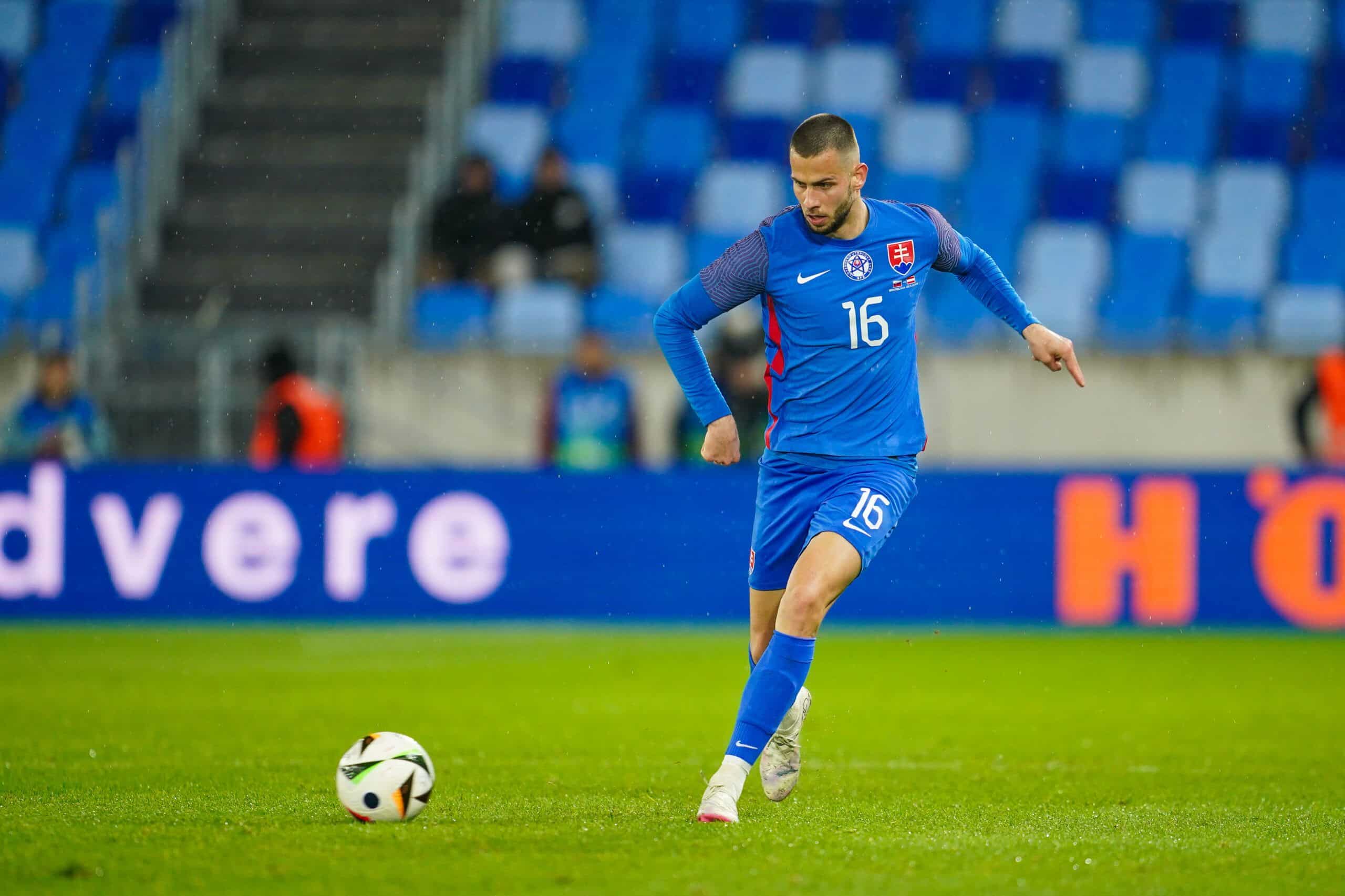 BRATISLAVA, SLOVAKIA - MARCH 23: David Hancko of Slovakia passes the ball during the international friendly match between Slovakia and Austria at National Football stadium on March 23, 2024 in Bratislava, Slovakia. (Photo by Christian Hofer/Getty Images)