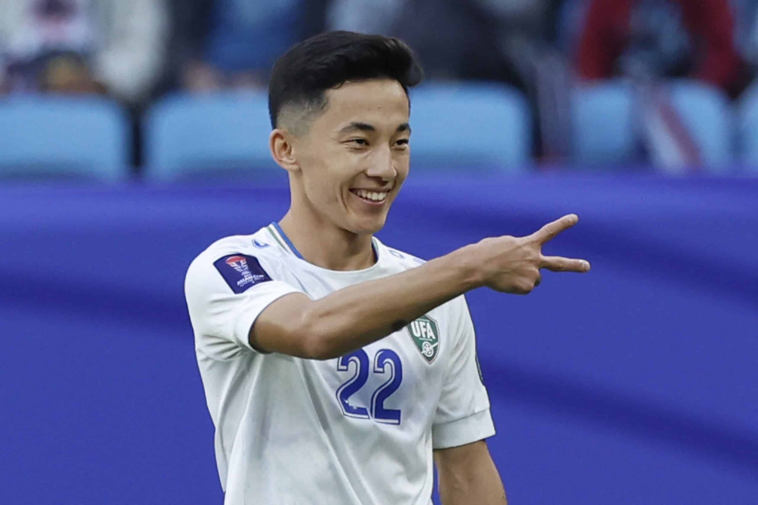 Uzbekistan's midfielder #22 Abbosbek Fayzullaev celebrates after scoring his team's second goal during the Qatar 2023 AFC Asian Cup football match between Uzbekistan and Thailand at Al-Janoub Stadium in al-Wakrah, south of Doha, on January 30, 2024. (Photo by KARIM JAAFAR / AFP) (Photo by KARIM JAAFAR/AFP via Getty Images)