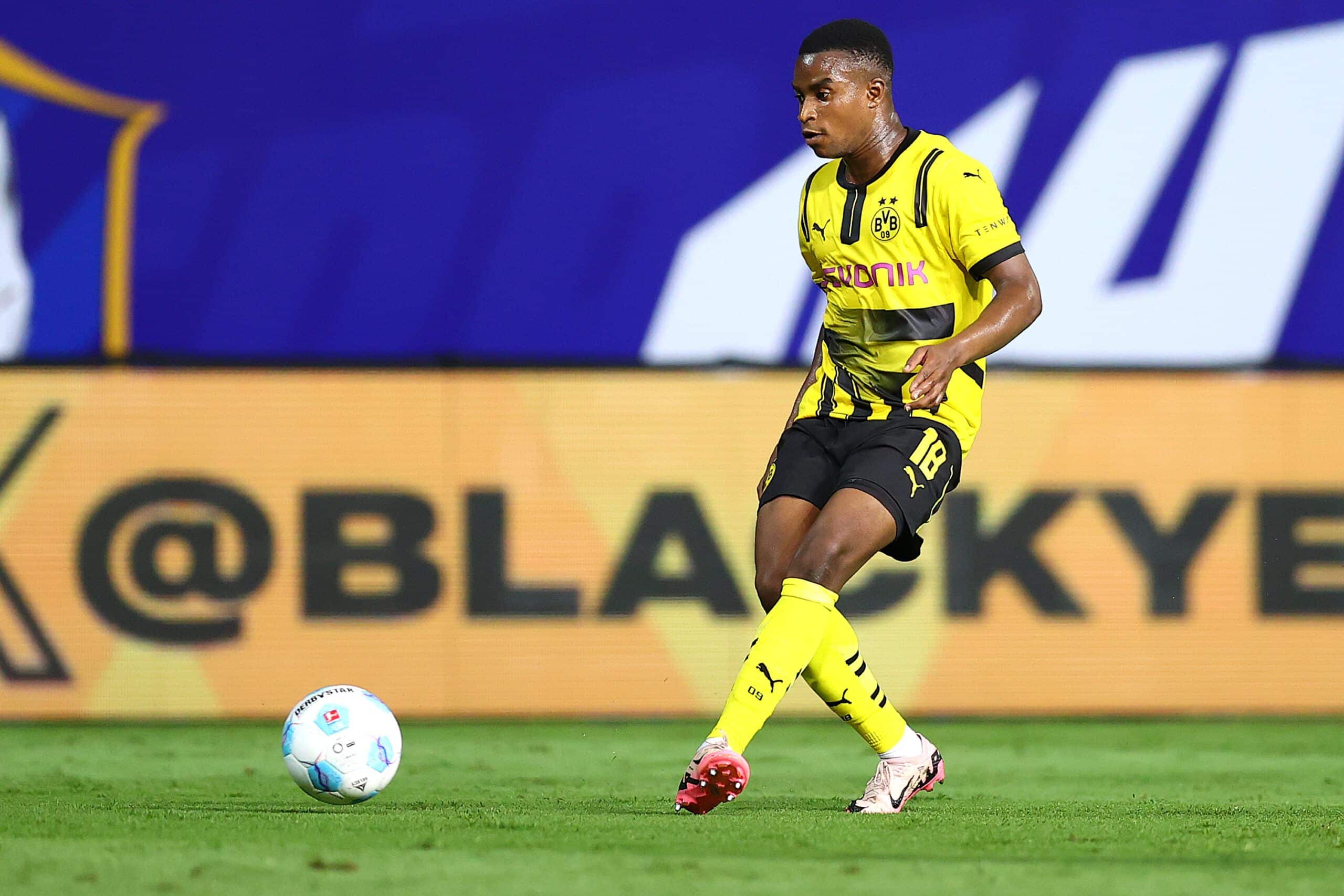 PATHUM THANI, THAILAND - JULY 21: Youssoufa Moukoko of Borussia Dortmund passes the ball to his teammate during the pre-season friendly match between Borussia Dortmund and BG Pathum United at BG Stadium on July 21, 2024 in Pathum Thani, Thailand. (Photo by Pakawich Damrongkiattisak/Getty Images)