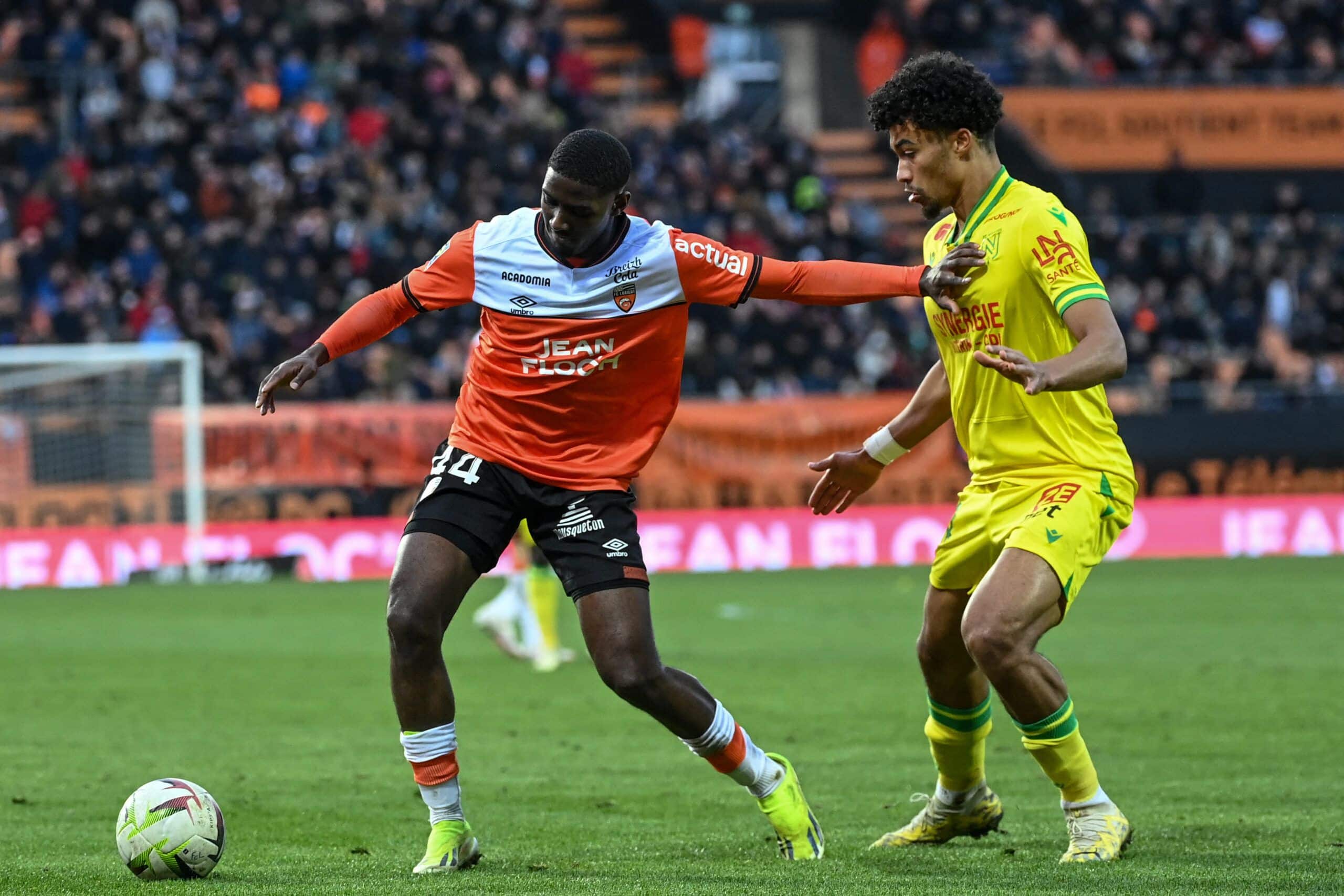 Lorient's French midfielder #44 Ayman Kari (L) fights for the ball with Nantes' French defender #44 Nathan Zeze during the French L1 football match between FC Lorient and FC Nantes at Stade du Moustoir in Lorient, western France on February 24, 2024. (Photo by Sebastien SALOM-GOMIS / AFP) (Photo by SEBASTIEN SALOM-GOMIS/AFP via Getty Images)
