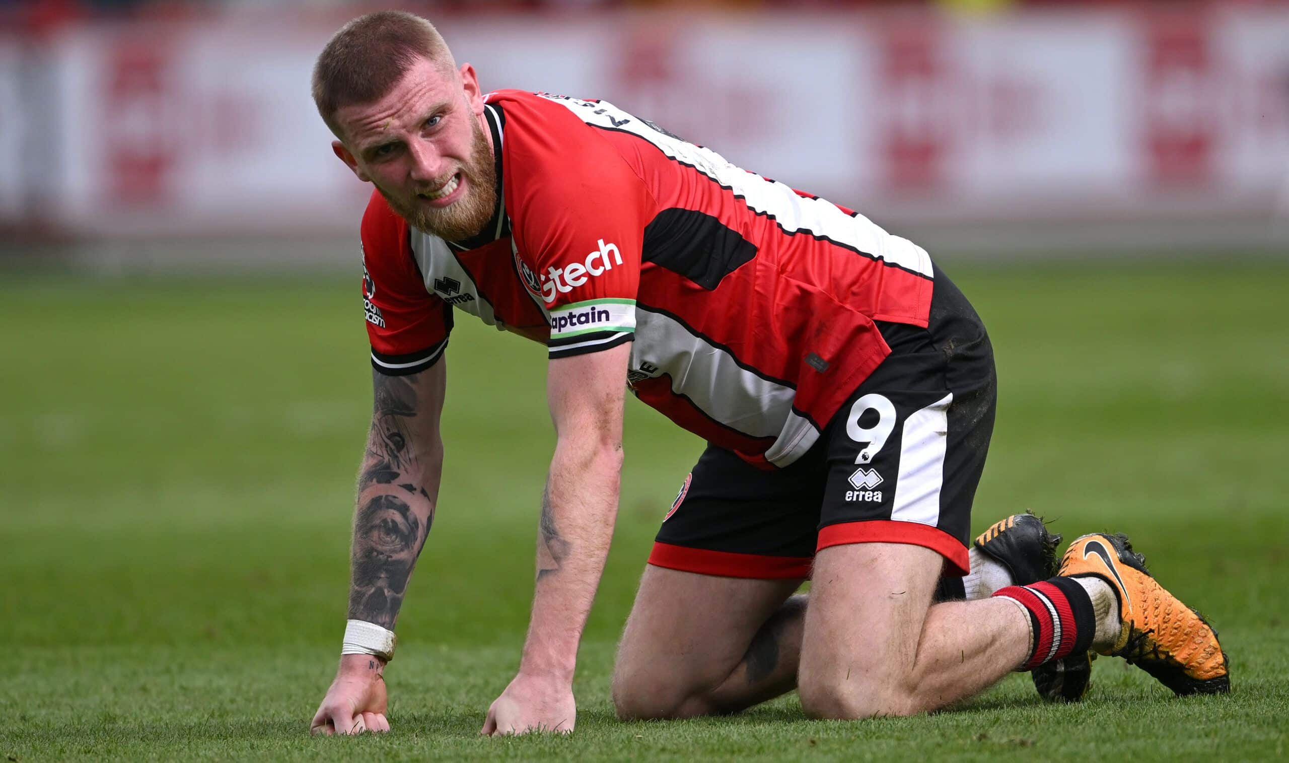 SHEFFIELD, ENGLAND - APRIL 20: Sheffield United captain Oli McBurnie reacts frustratingly during the Premier League match between Sheffield United and Burnley FC at Bramall Lane on April 20, 2024 in Sheffield, England. (Photo by Stu Forster/Getty Images)