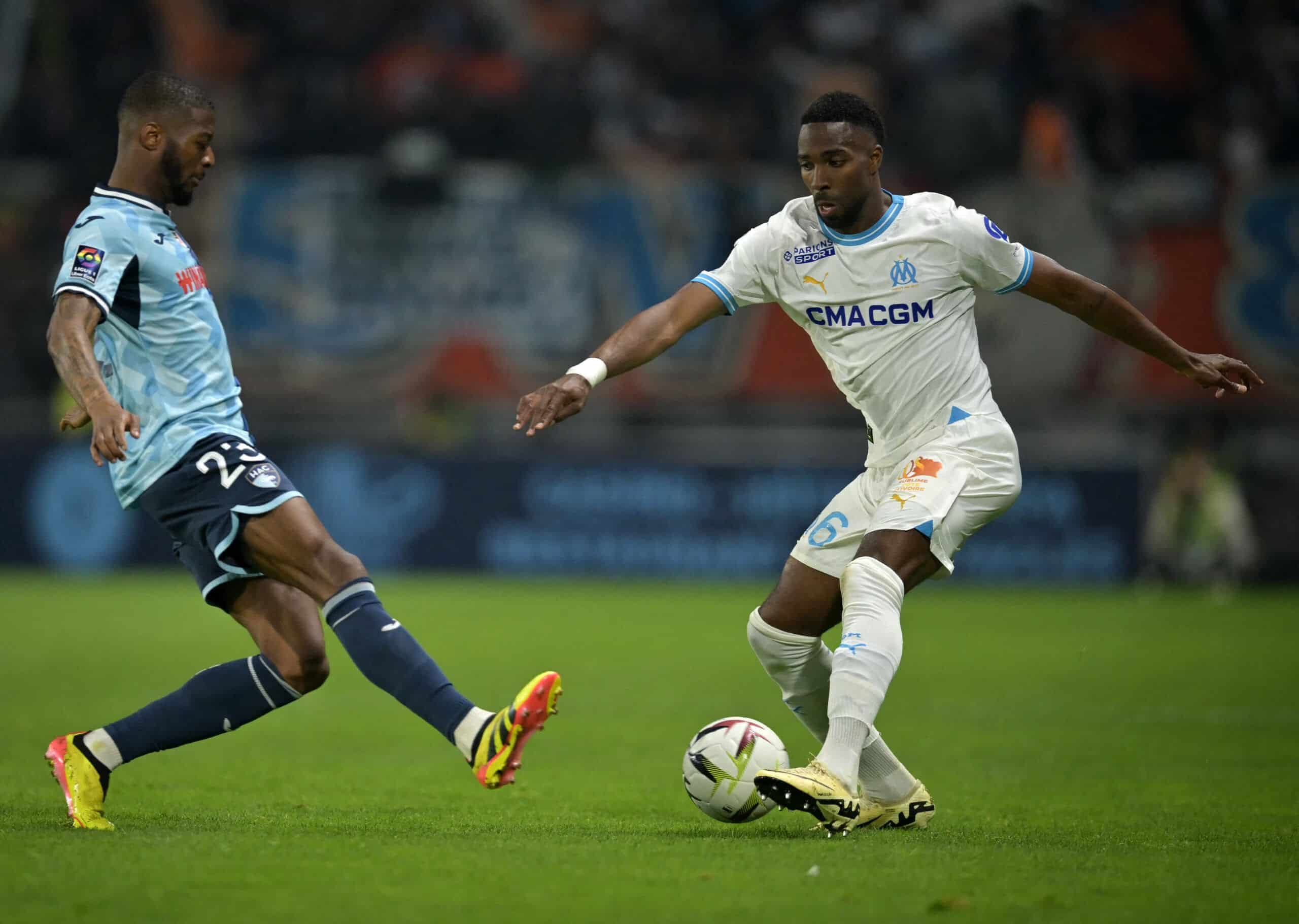 Le Havre's French forward #23 Josue Casimir (L) fights for the ball with Marseille's Swiss defender #06 Ulisses Garcia during the French L1 football match between Le Havre AC and Olympique Marseille (OM) at The Stade Oceane in Le Havre, north-western France, on May 19, 2024. (Photo by Lou BENOIST / AFP) (Photo by LOU BENOIST/AFP via Getty Images)
