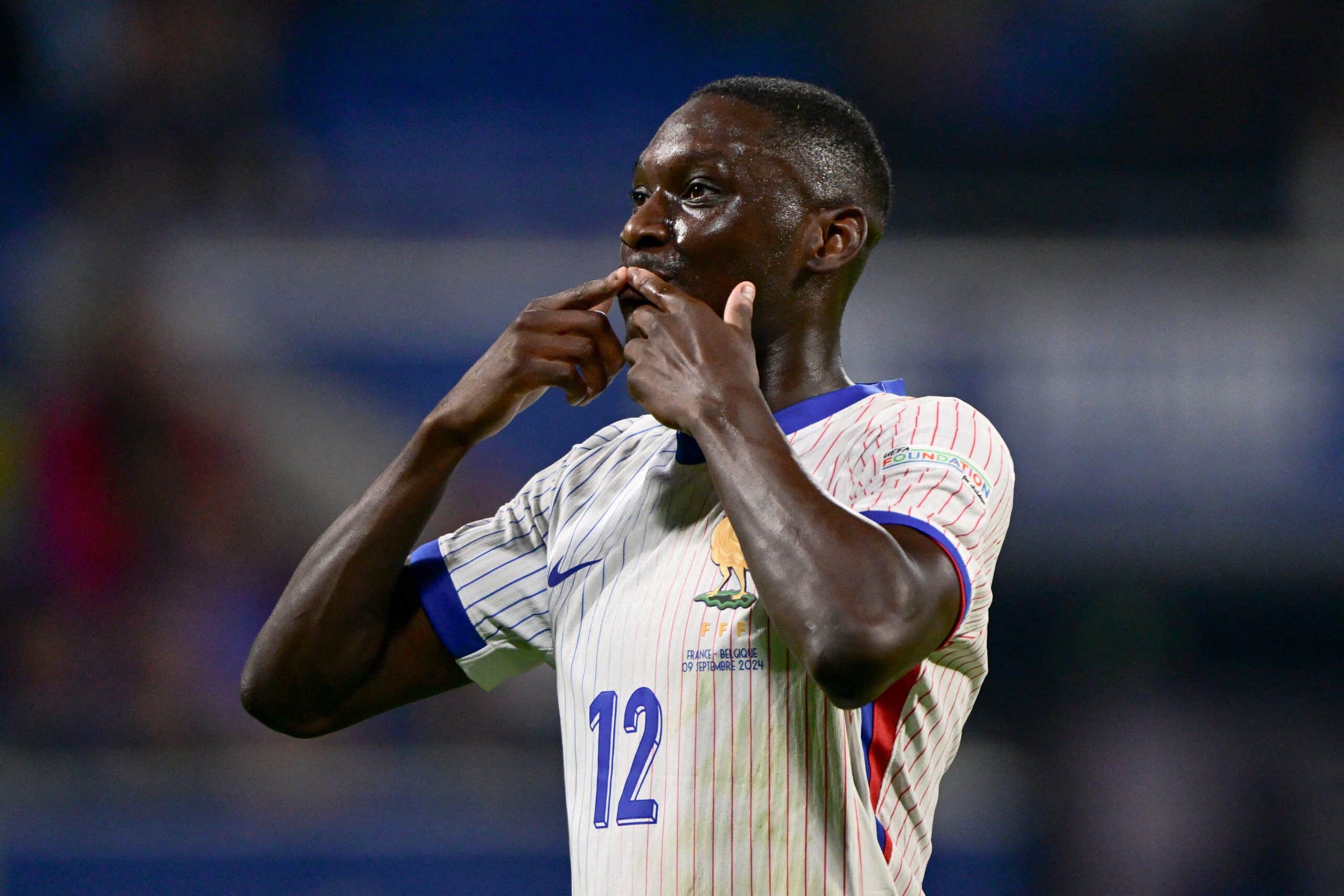TOPSHOT - France's forward #12 Randal Kolo Muani celebrates after scoring France's first goal during the UEFA Nations League, League A - Group 2 first leg football match between France and Belgium at the Parc Olympique Lyonnais in Lyon on September 9, 2024. (Photo by Olivier CHASSIGNOLE / AFP) (Photo by OLIVIER CHASSIGNOLE/AFP via Getty Images)
