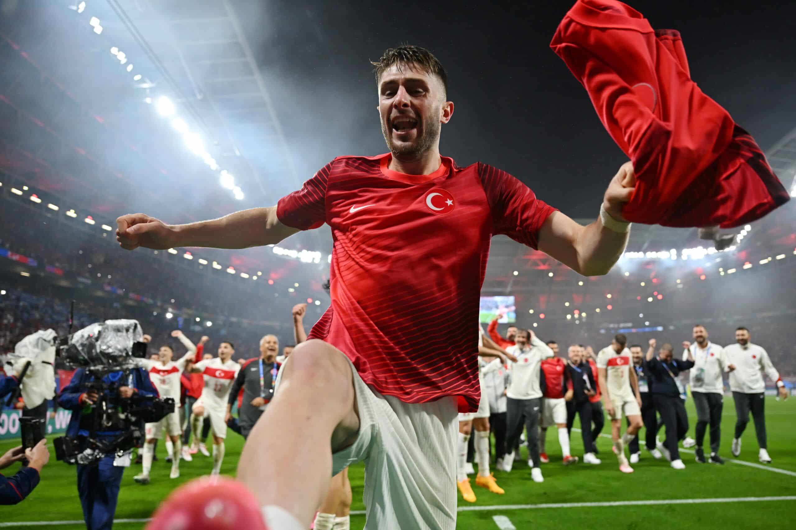 LEIPZIG, GERMANY - JULY 02: Ismail Yuksek of Turkiye celebrates in front of the fans after the team's victory in the UEFA EURO 2024 round of 16 match between Austria and Turkiye at Football Stadium Leipzig on July 02, 2024 in Leipzig, Germany. (Photo by Dan Mullan/Getty Images)
