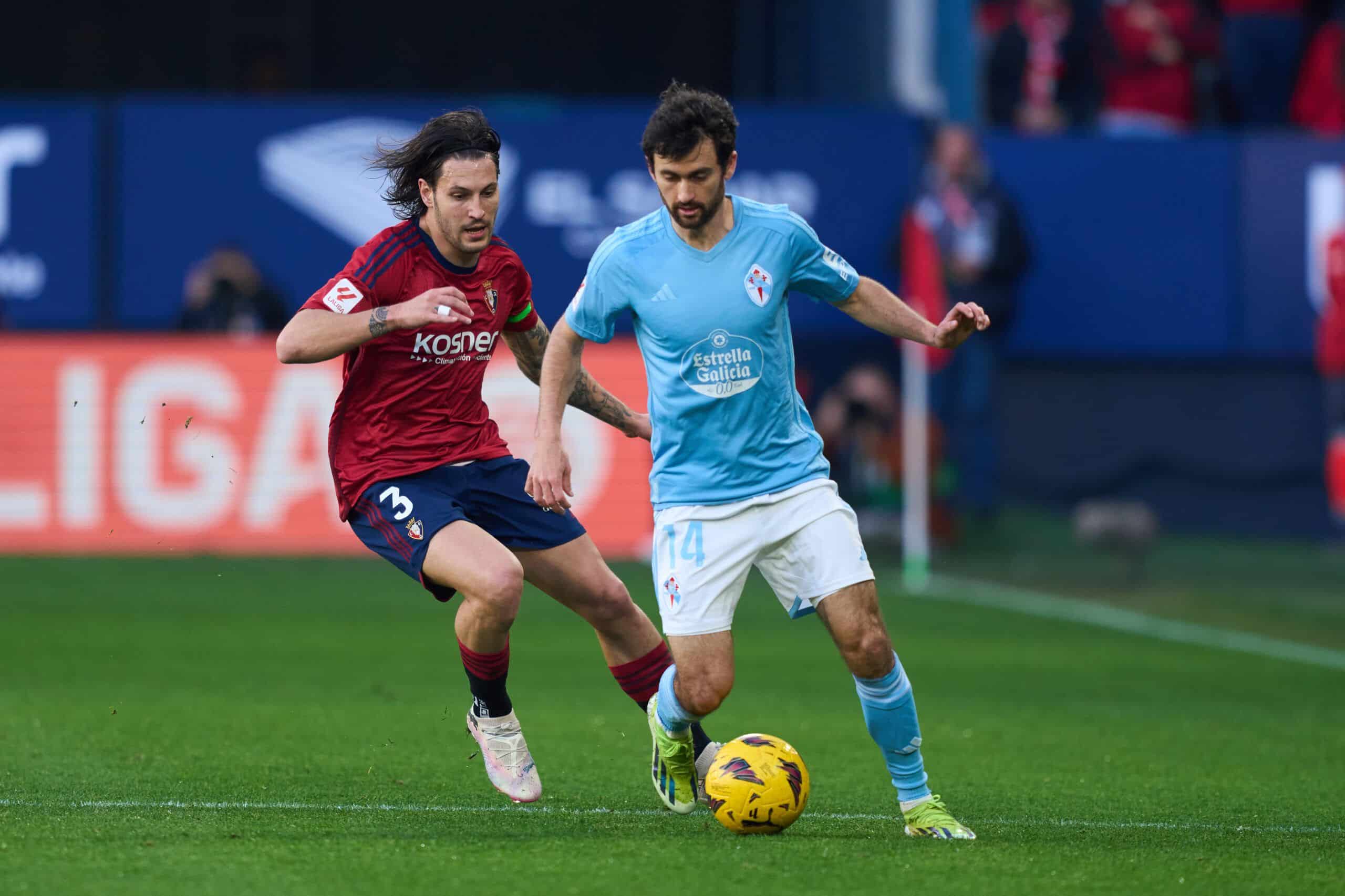 PAMPLONA, SPAIN - FEBRUARY 04: Luca de la Torre of RC Celta Vigo duels for the ball with Juan Cruz of CA Osasuna during the LaLiga EA Sports match between CA Osasuna and Celta Vigo at Estadio El Sadar on February 04, 2024 in Pamplona, Spain. (Photo by Juan Manuel Serrano Arce/Getty Images)