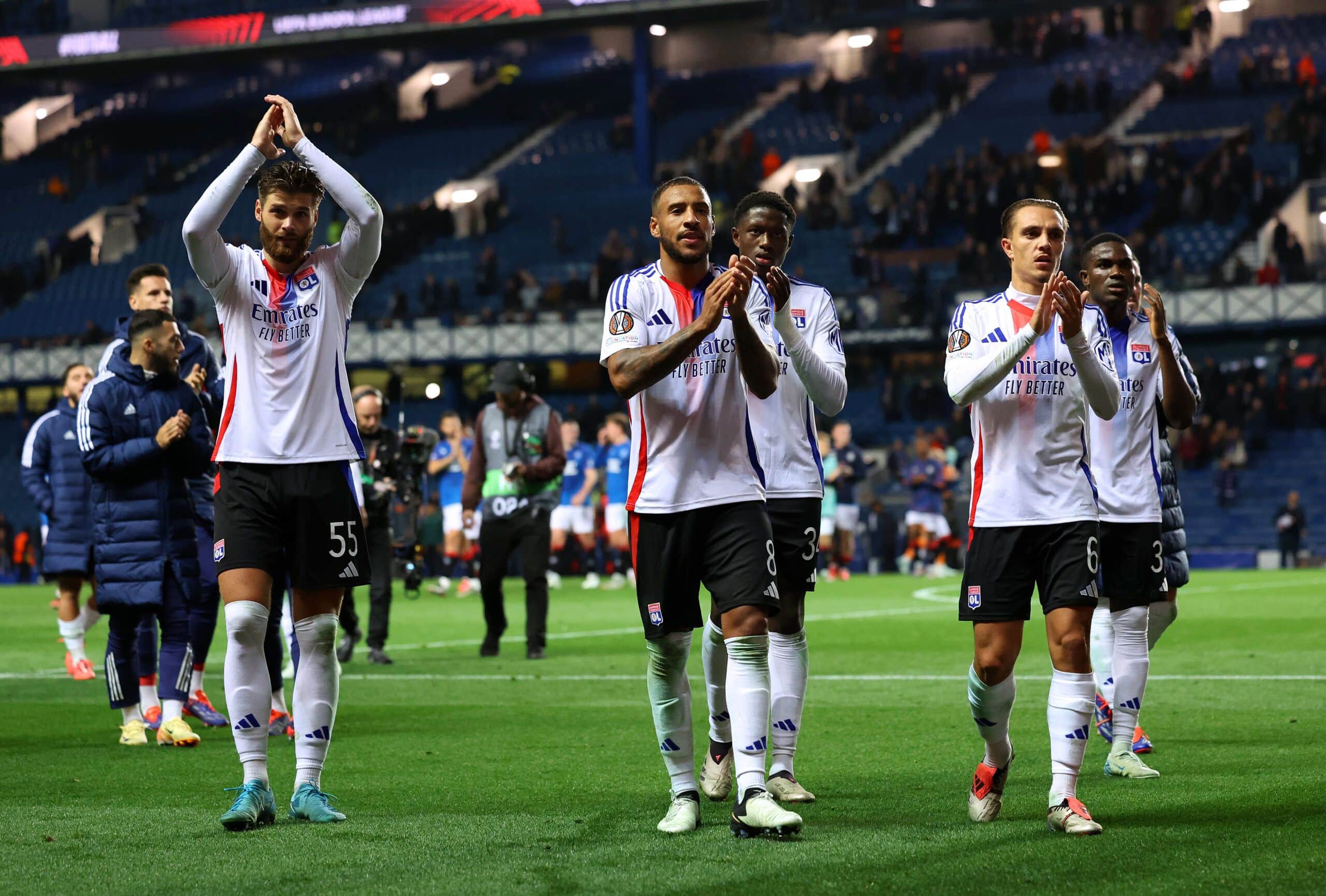 GLASGOW, SCOTLAND - OCTOBER 03: Duje Caleta-Car, Corentin Tolisso, Mahamadou Diawara and Maxence Caqueret of Olympique Lyonnais acknowledge the fans after the UEFA Europa League 2024/25 League Phase MD2 match between Rangers FC and Olympique Lyonnais at Ibrox Stadium on October 03, 2024 in Glasgow, Scotland. (Photo by Ian MacNicol/Getty Images)