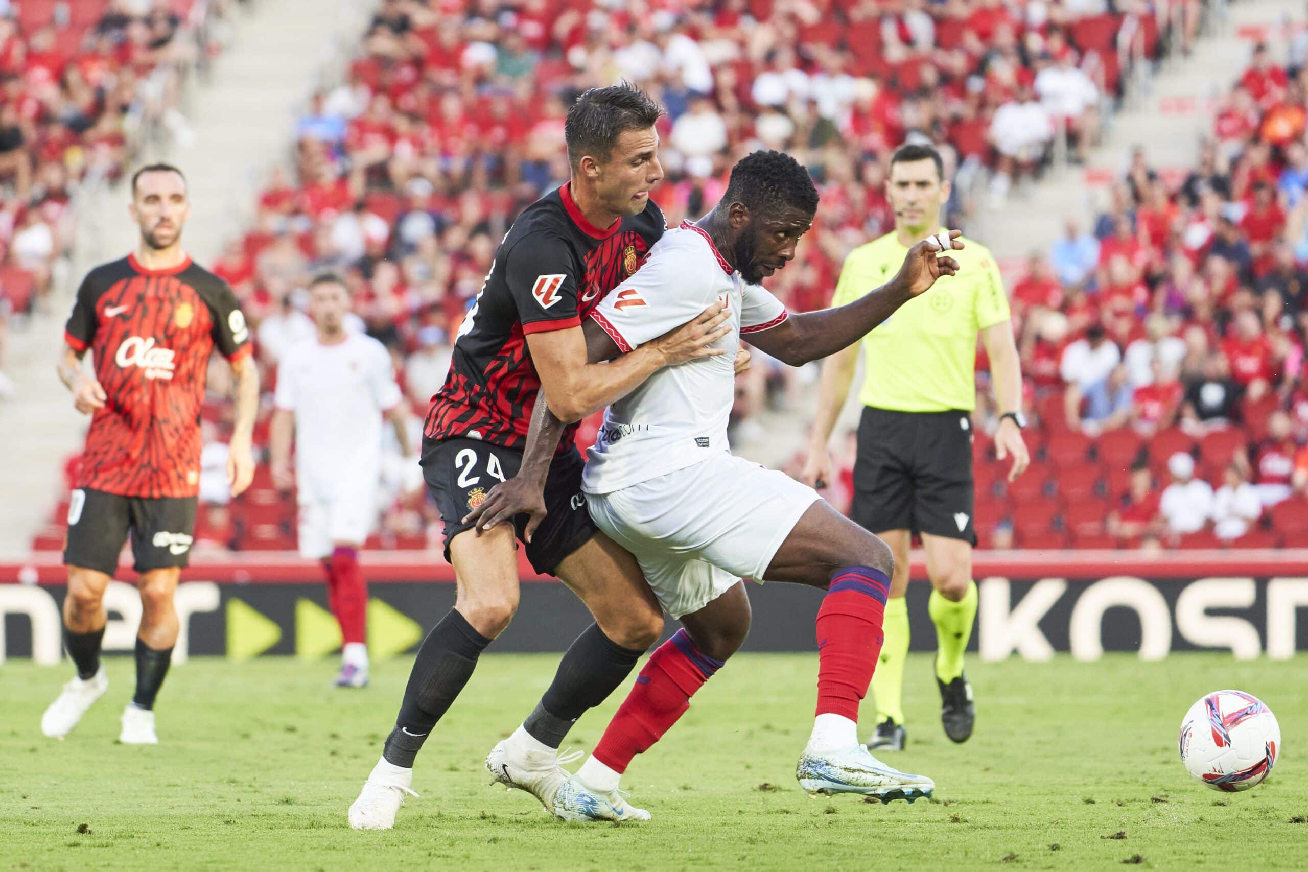 MALLORCA, SPAIN - AUGUST 27: Martin Valjent of RCD Mallorca and Kelechi Iheanacho of Sevilla FC competes for the ball during the La Liga match between RCD Mallorca and Sevilla FC at Estadi de Son Moix on August 27, 2024 in Mallorca, Spain. (Photo by Rafa Babot/Getty Images)