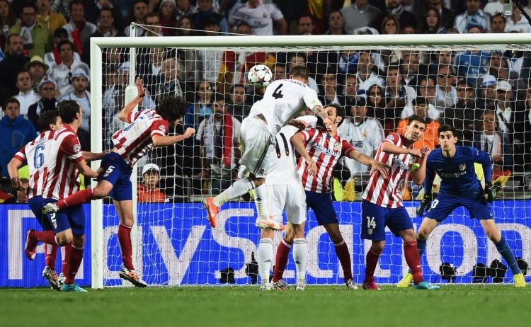 LISBON, PORTUGAL - MAY 24: Sergio Ramos of Real Madrid (4) scores their first goal with a header during the UEFA Champions League Final between Real Madrid and Atletico de Madrid at Estadio da Luz on May 24, 2014 in Lisbon, Portugal. (Photo by Laurence Griffiths/Getty Images)